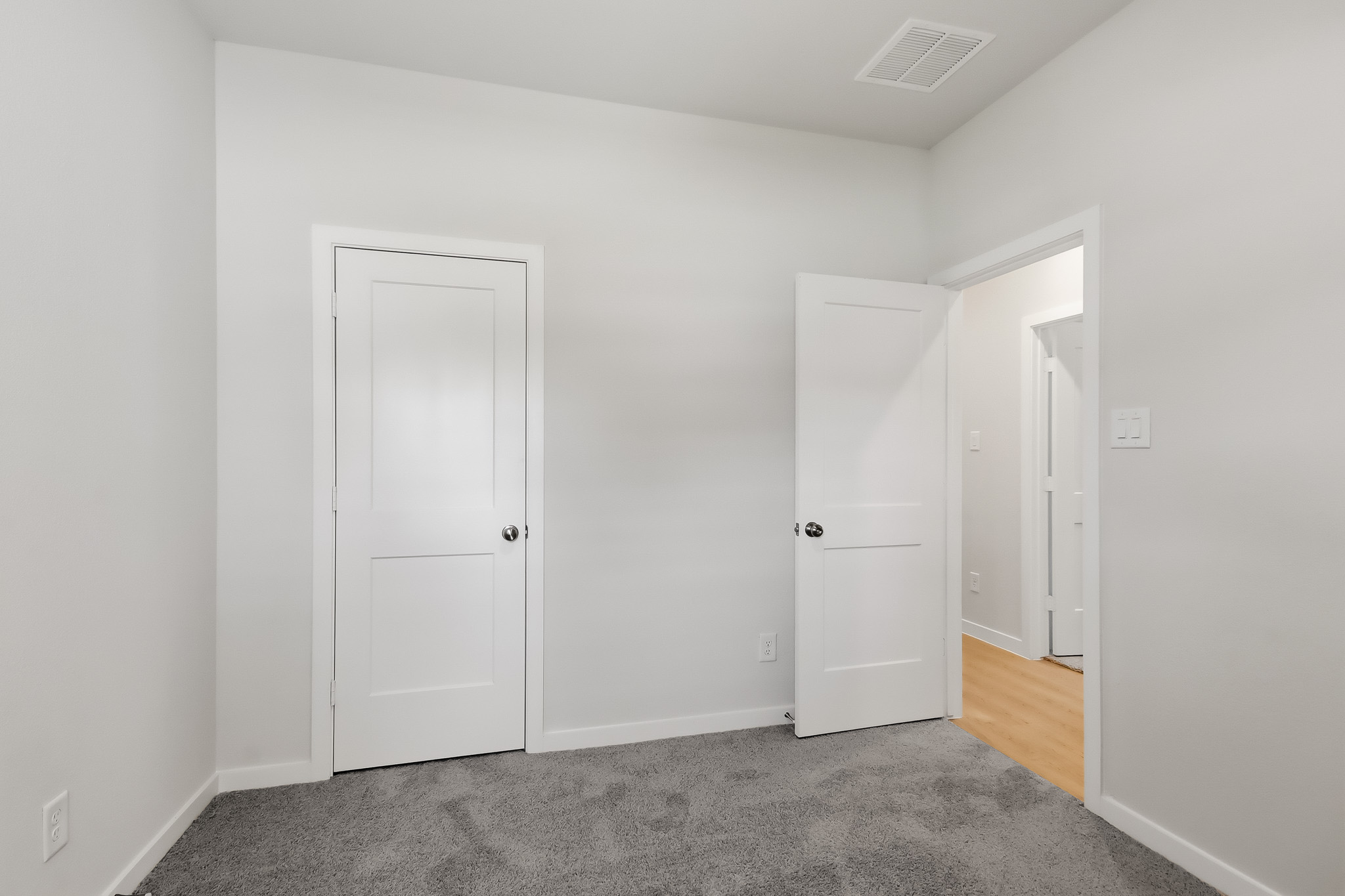 A room with white doors.