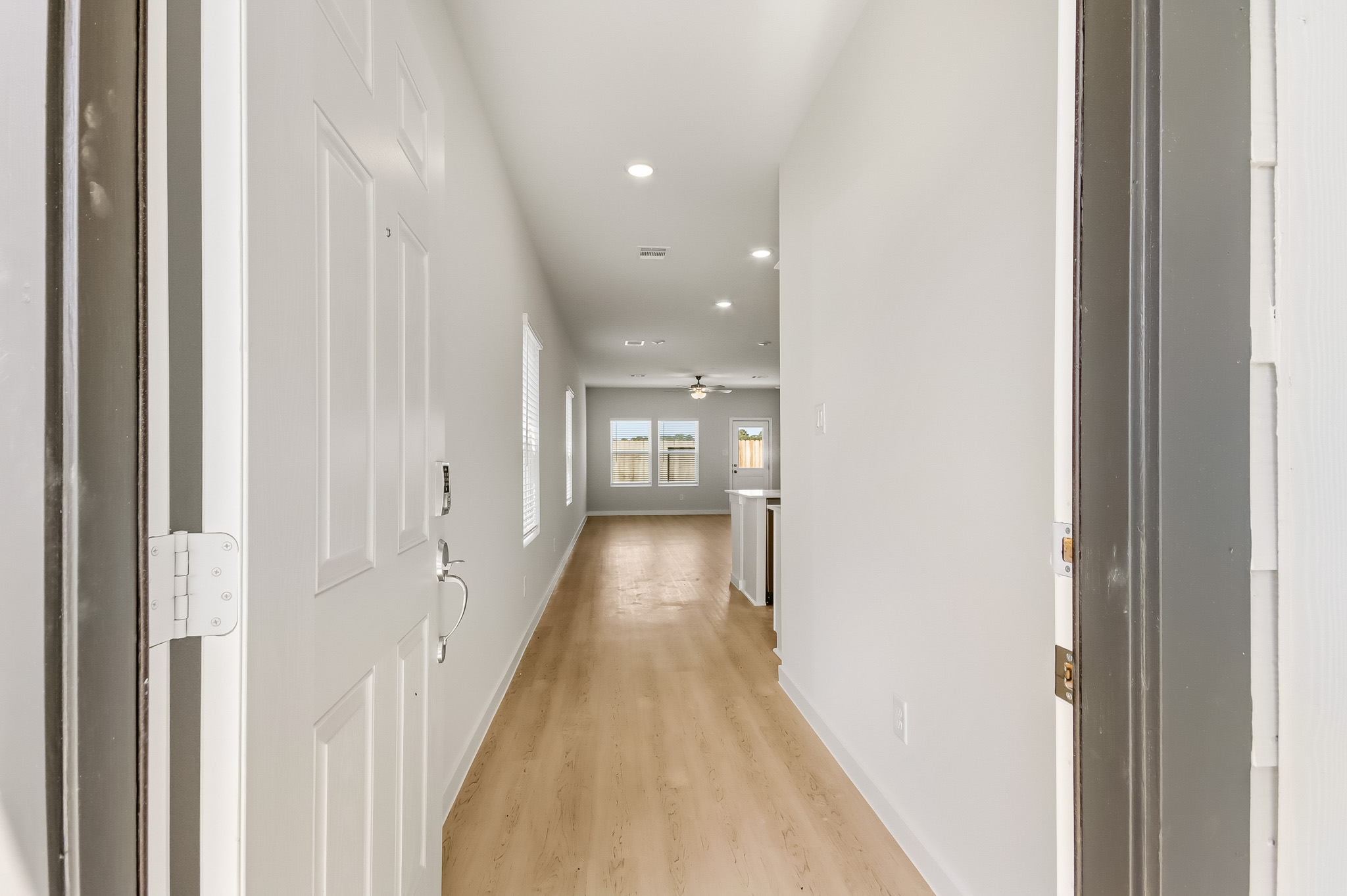 A hallway with white doors.