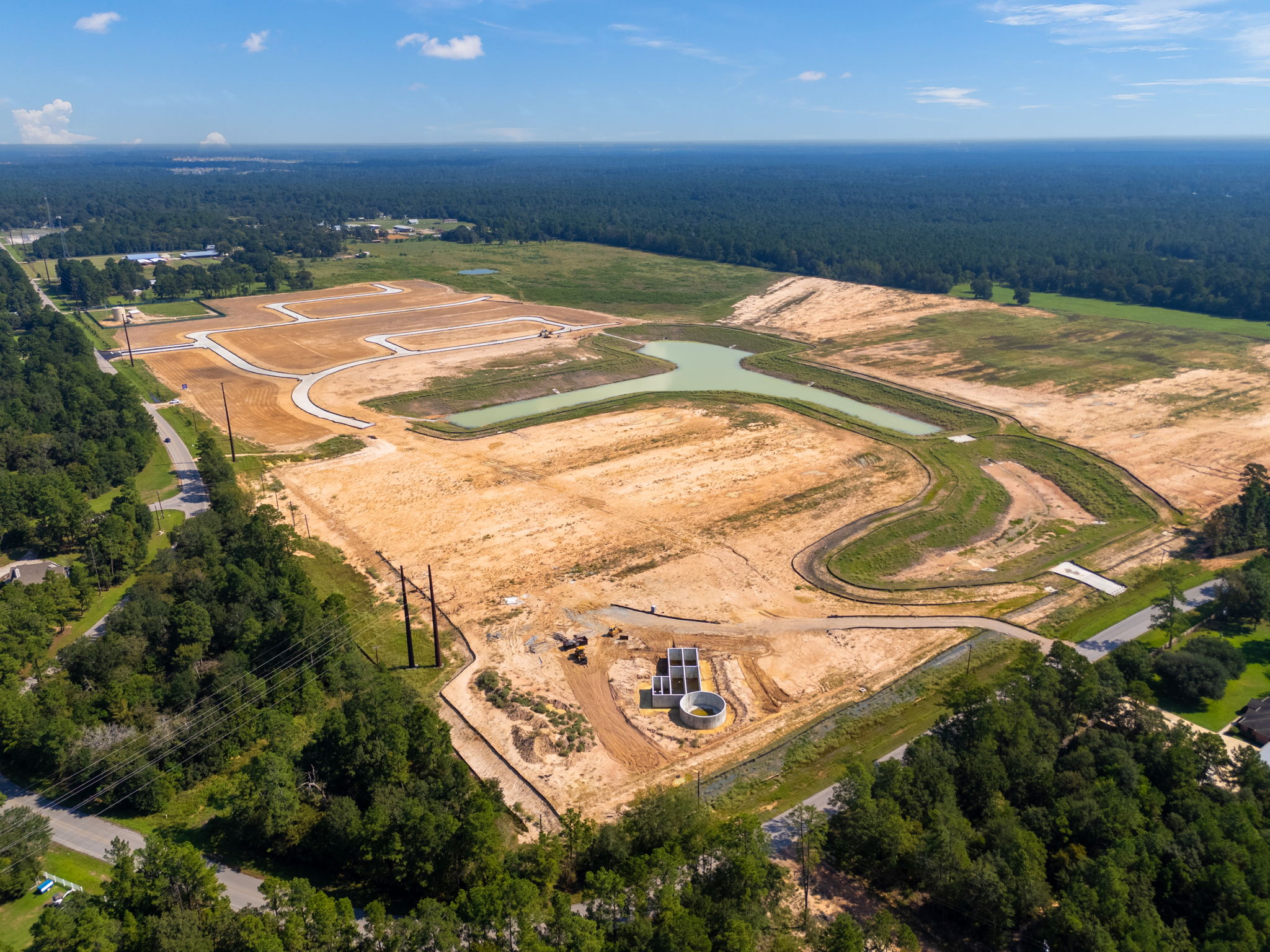 A landscape with a river and trees.