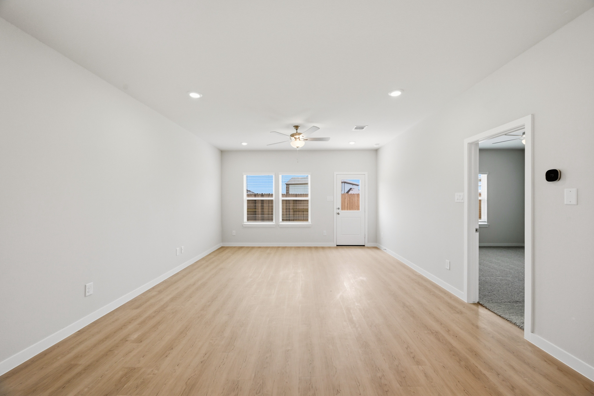 A room with a wood floor and a wood floor.