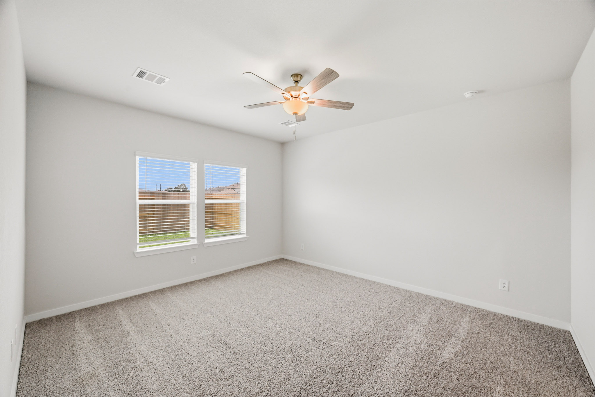 A ceiling fan in a room.
