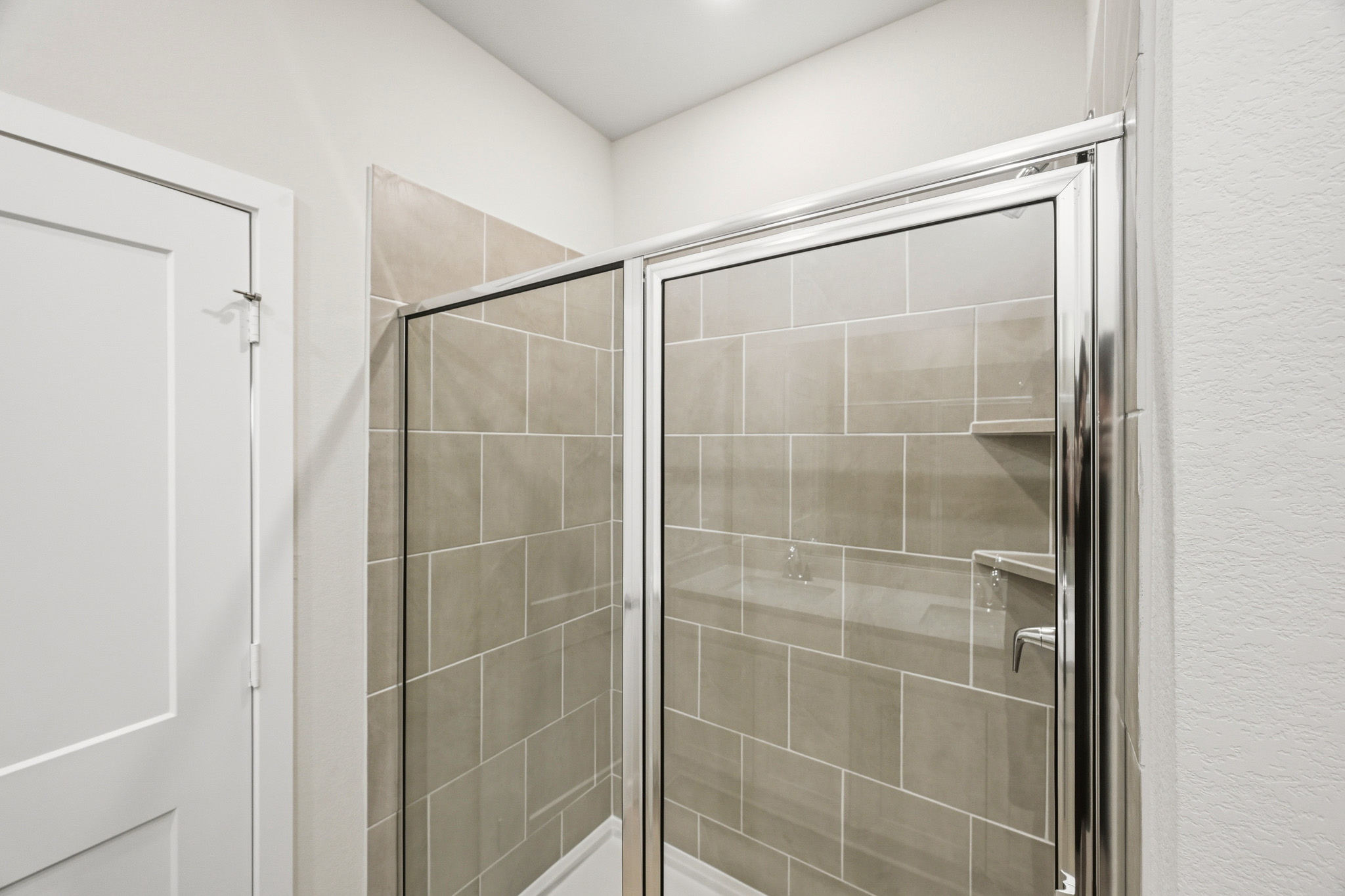 A shower unit in a bathroom.