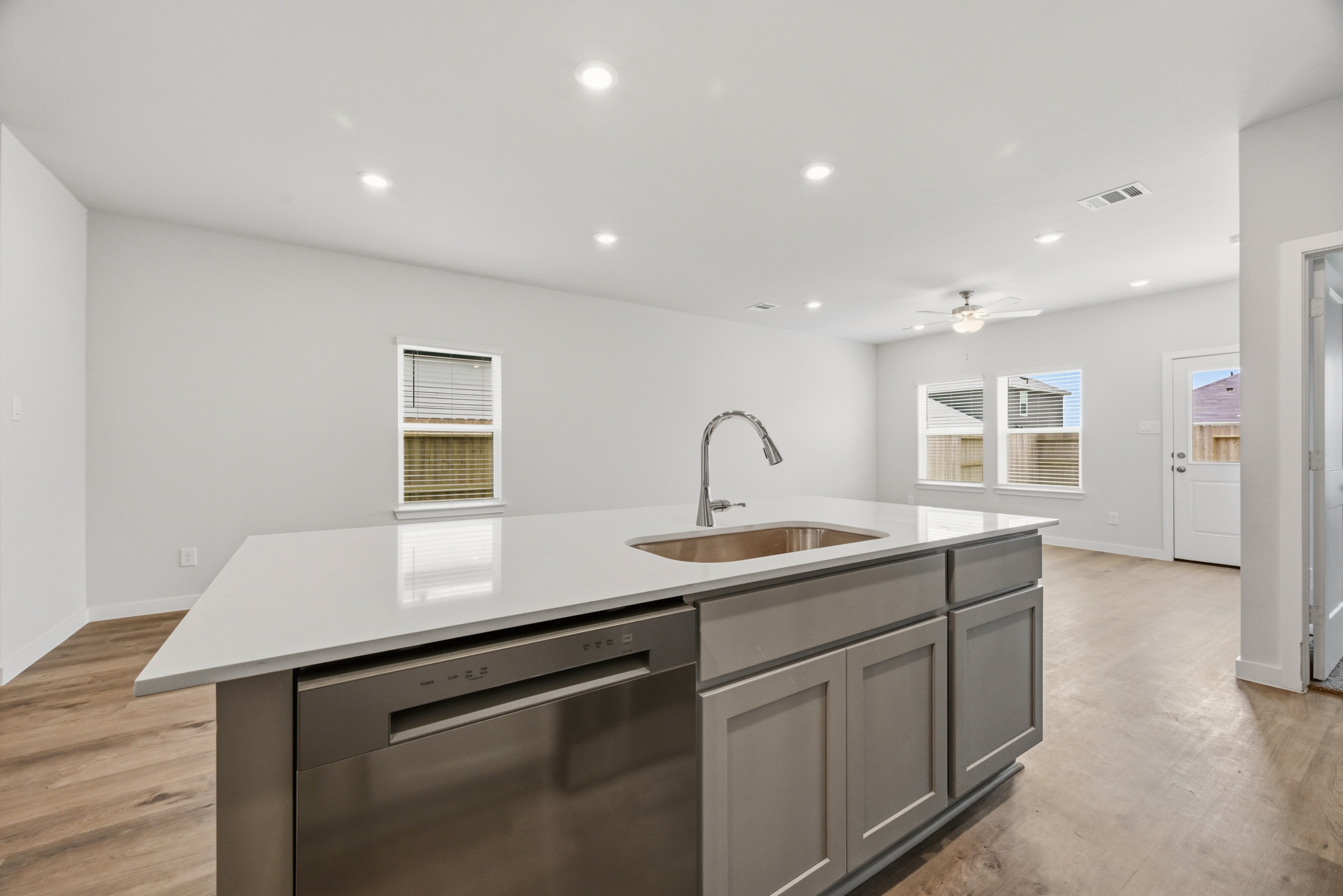A kitchen with a sink and cabinets.