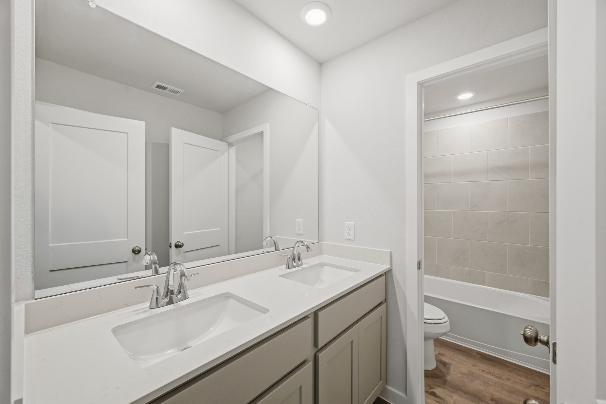 A bathroom with a sink and a toilet.