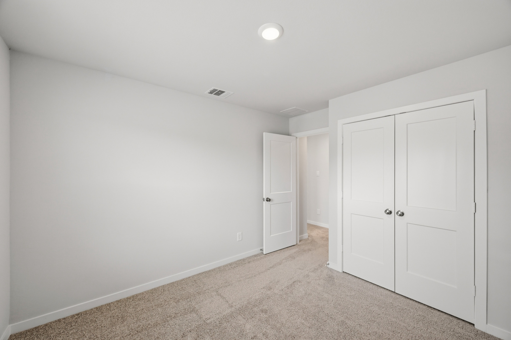 A room with white doors.
