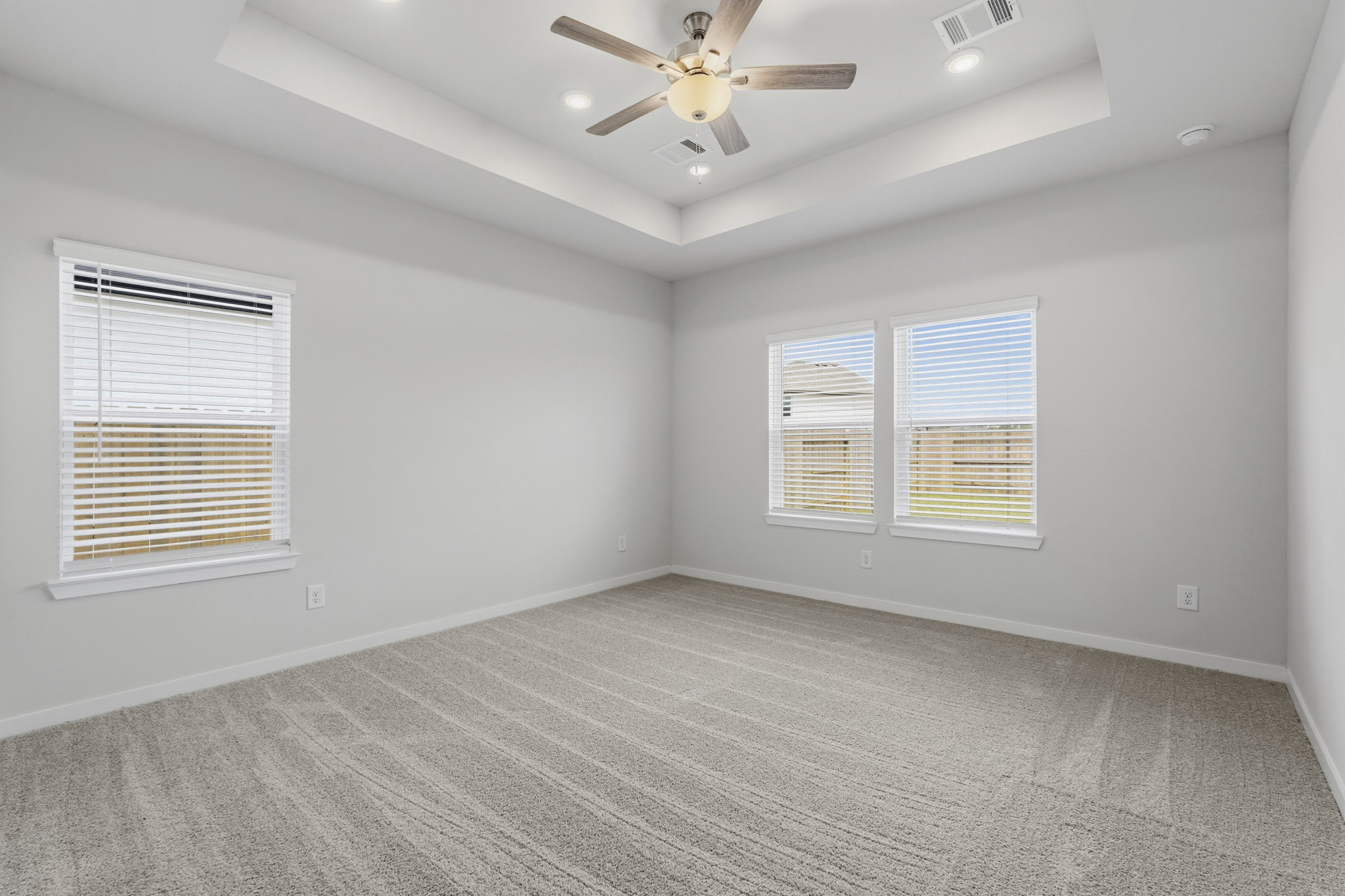 A room with a ceiling fan and a ceiling fan.