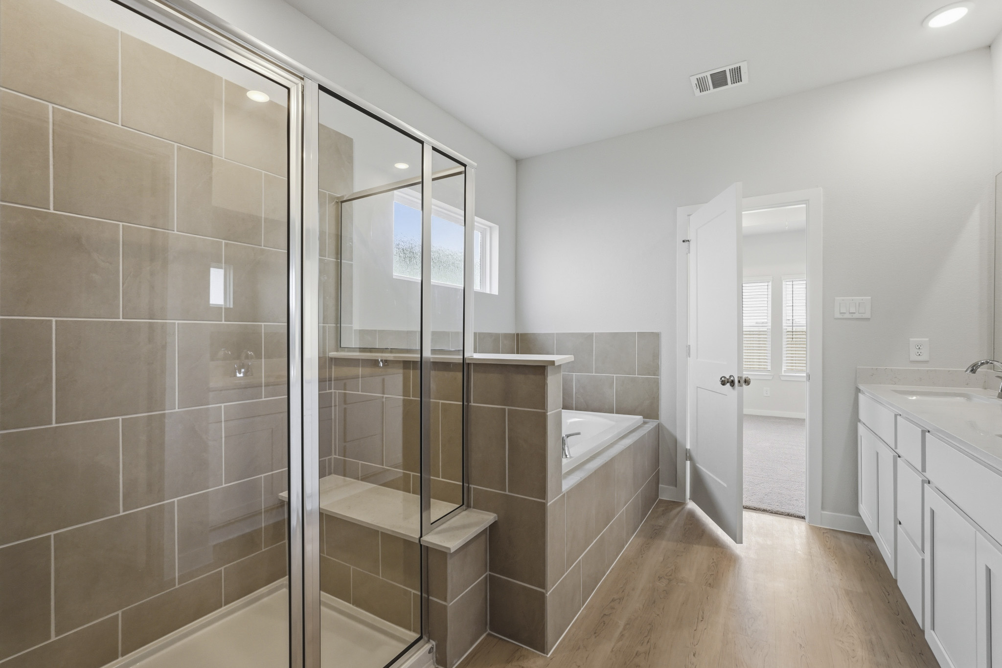 A bathroom with a glass shower.