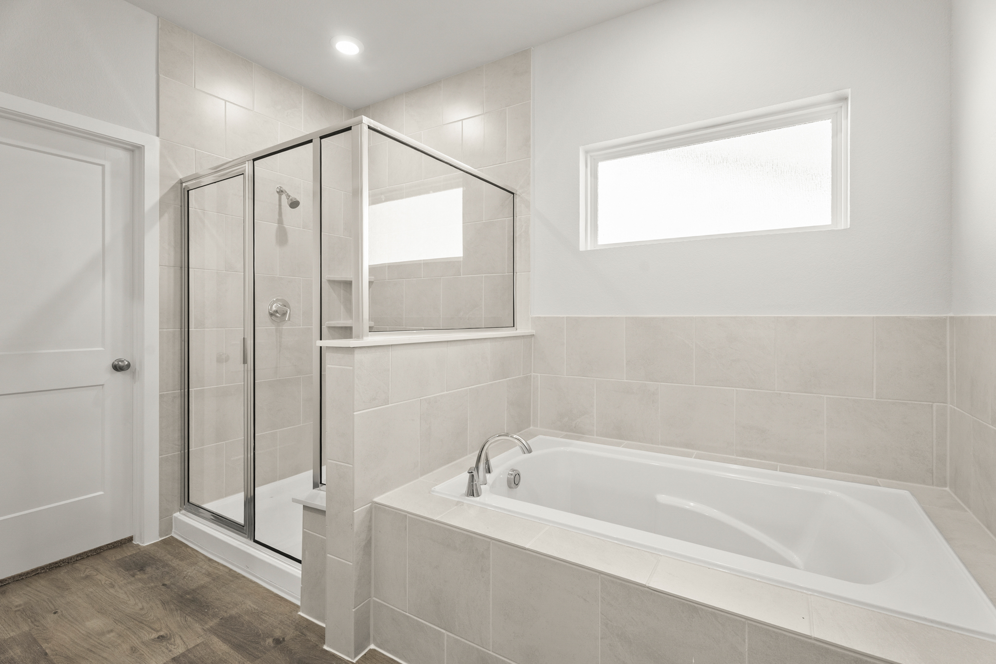 A bathroom with a glass shower.
