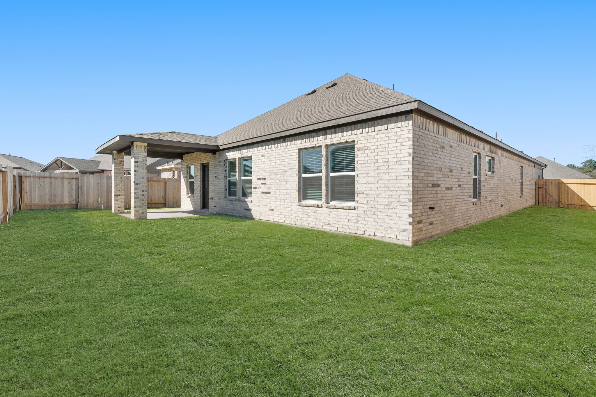 A house with a grass yard.