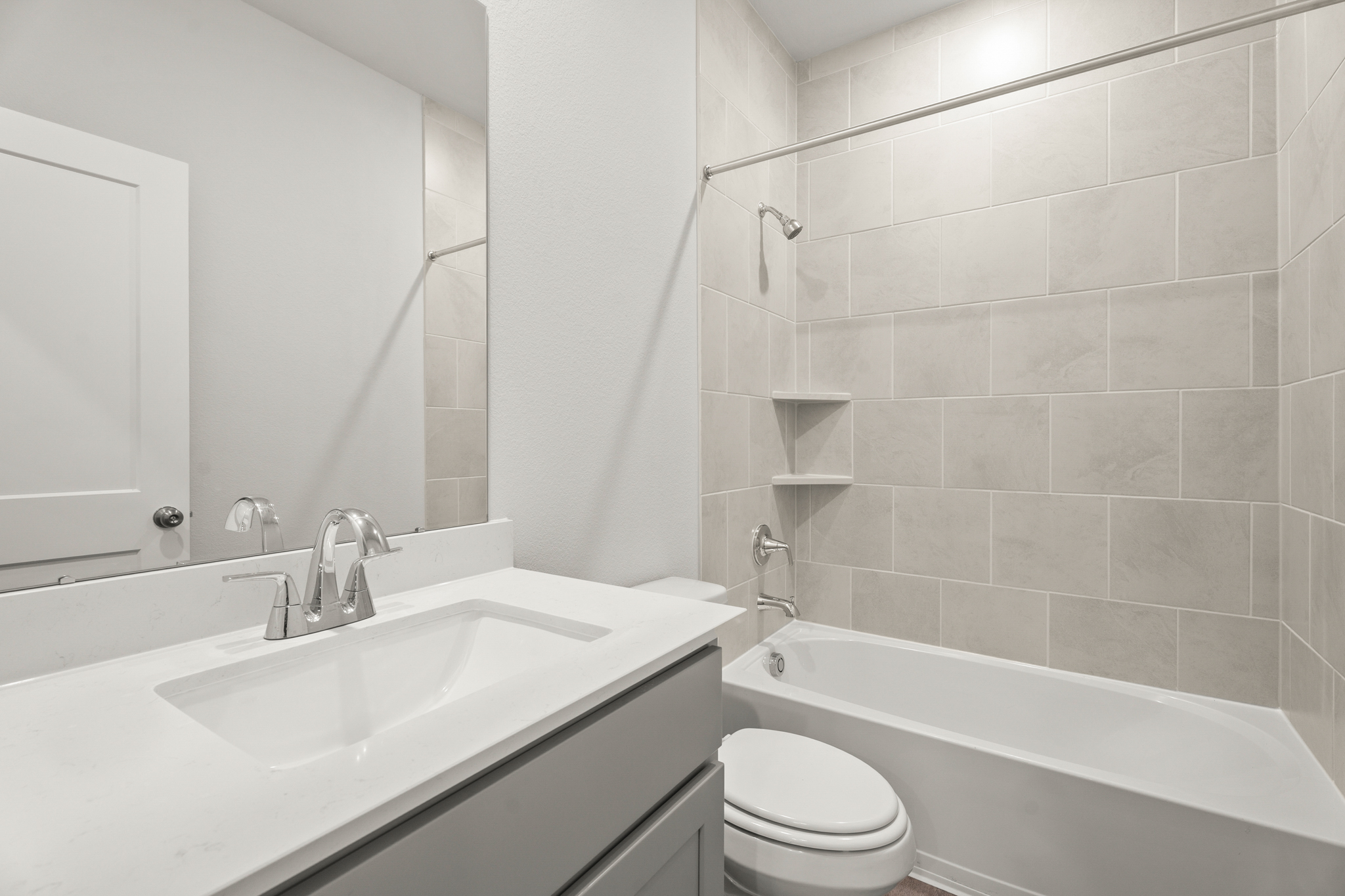 A bathroom with a sink and a toilet.