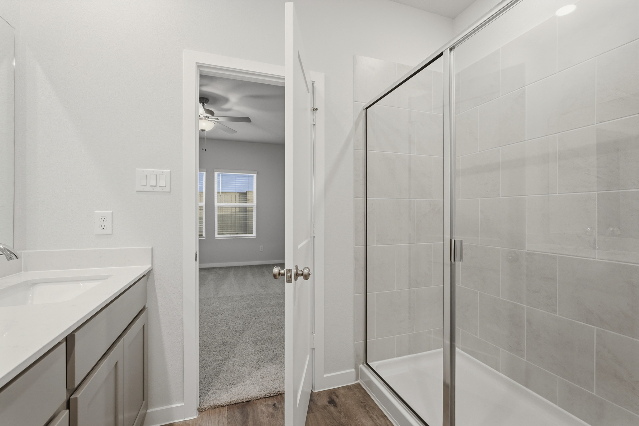 A bathroom with a glass shower.