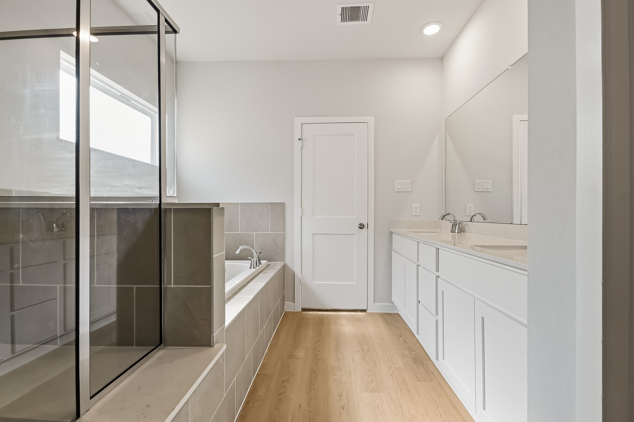 A bathroom with a glass shower.
