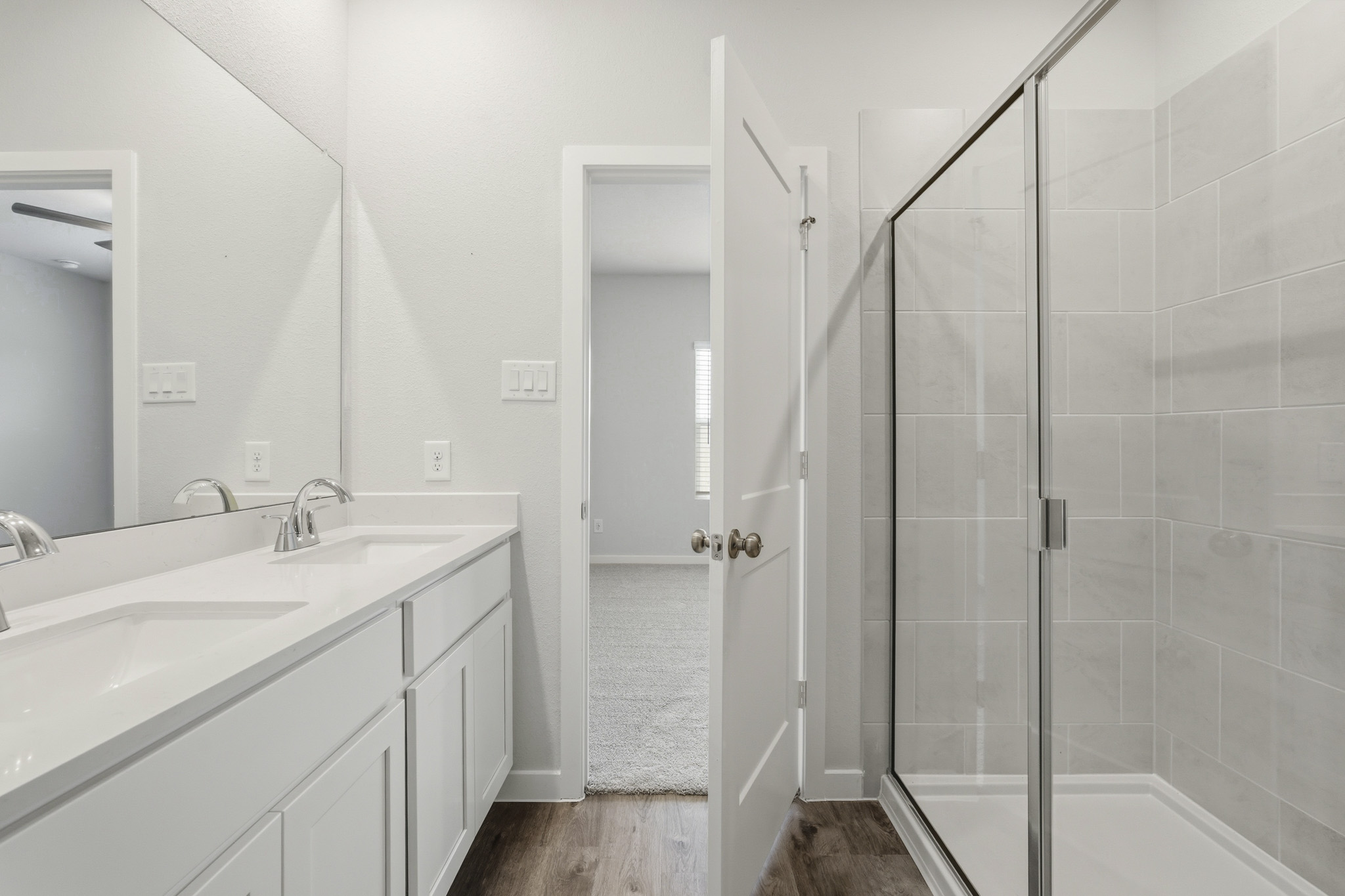 A bathroom with a glass shower.