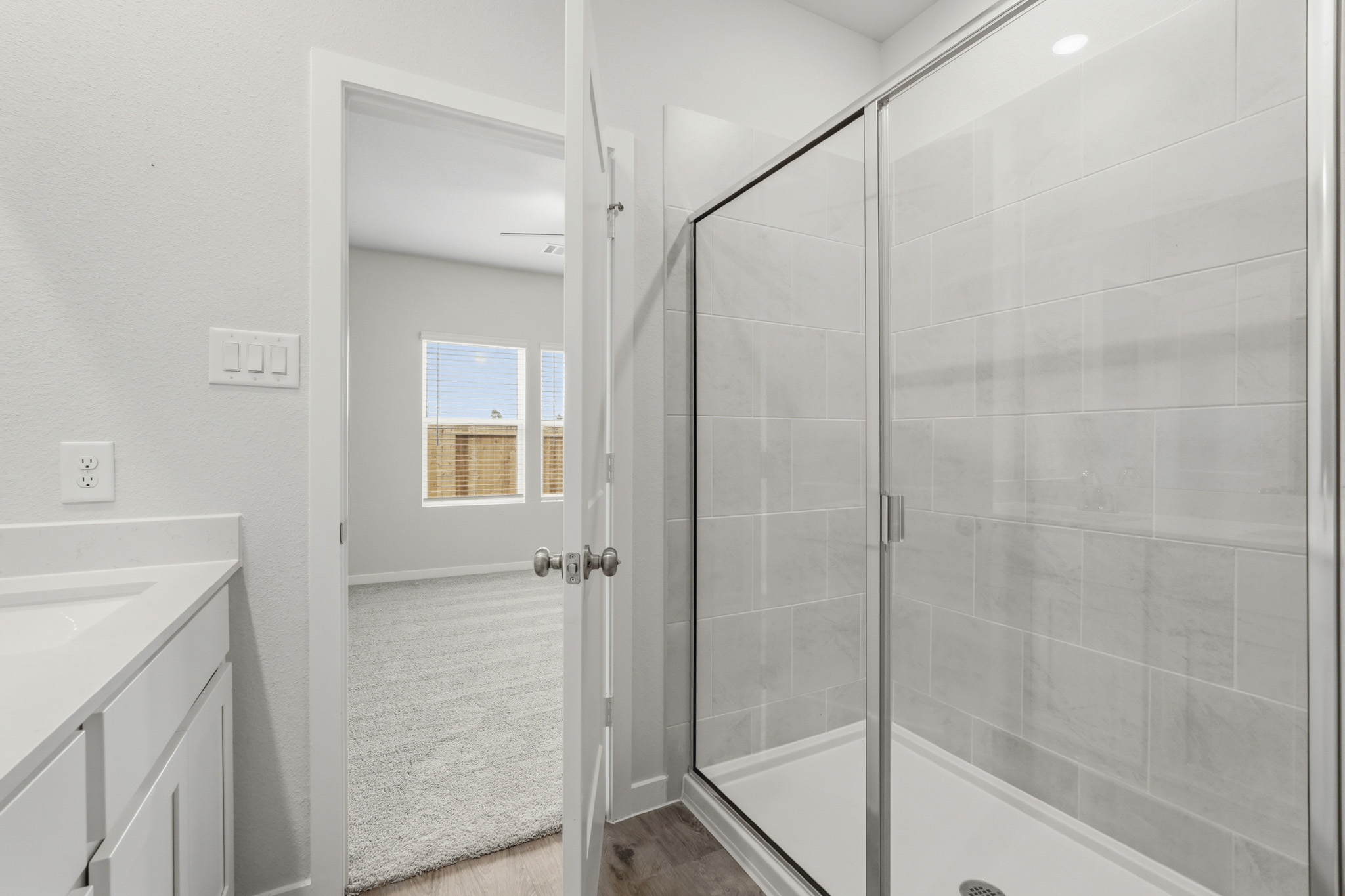 A bathroom with a glass shower.