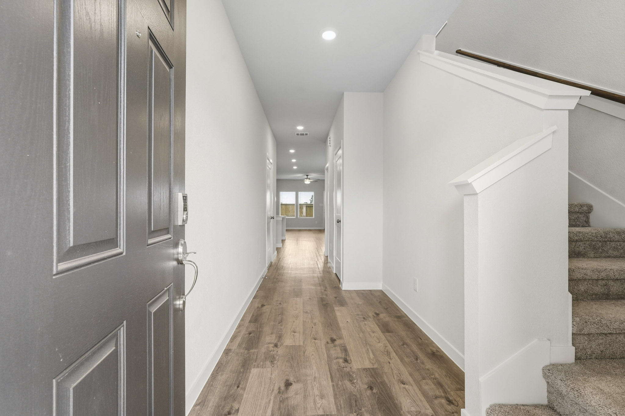 A hallway with white walls.