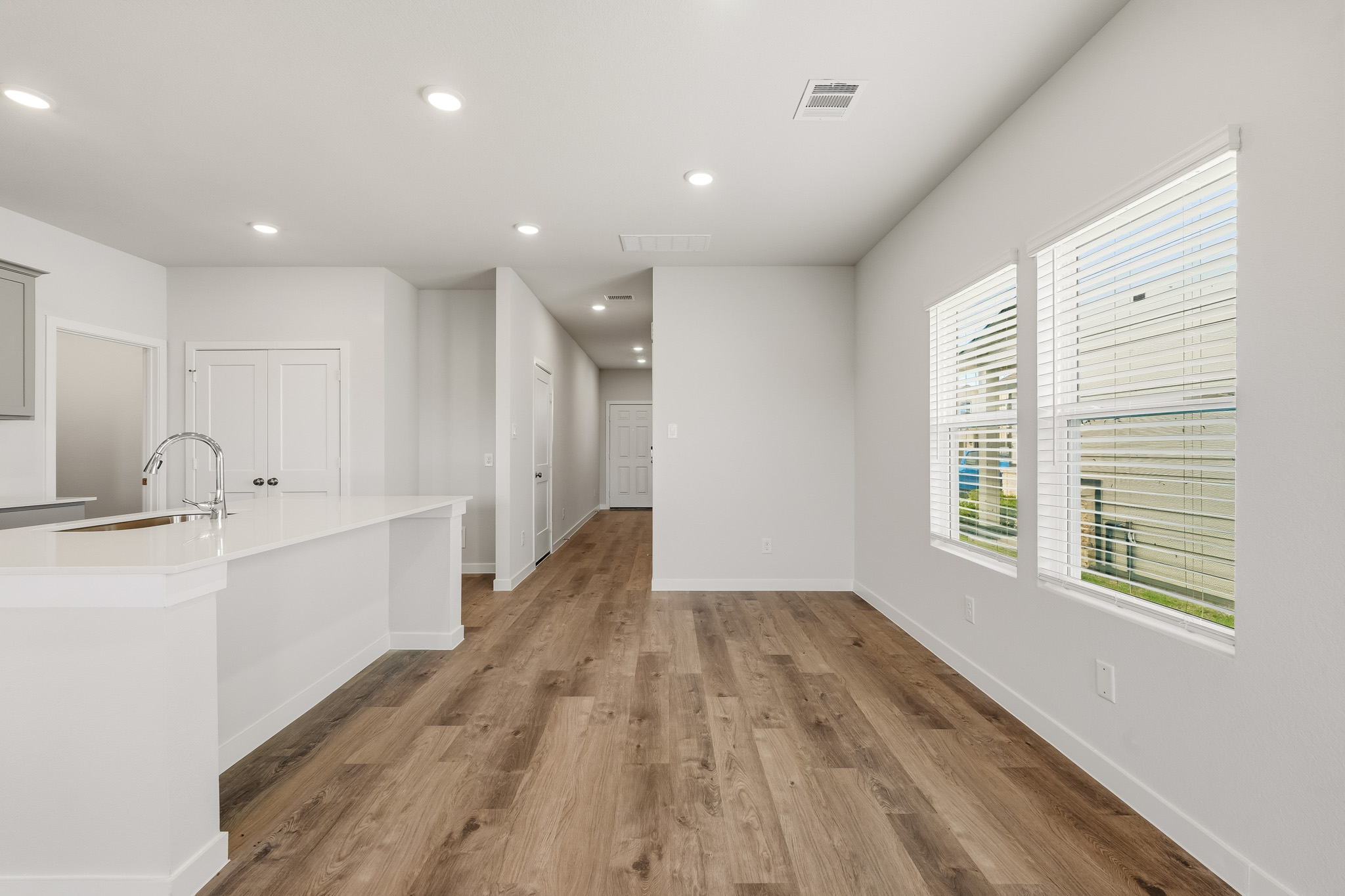 A bathroom with white walls.