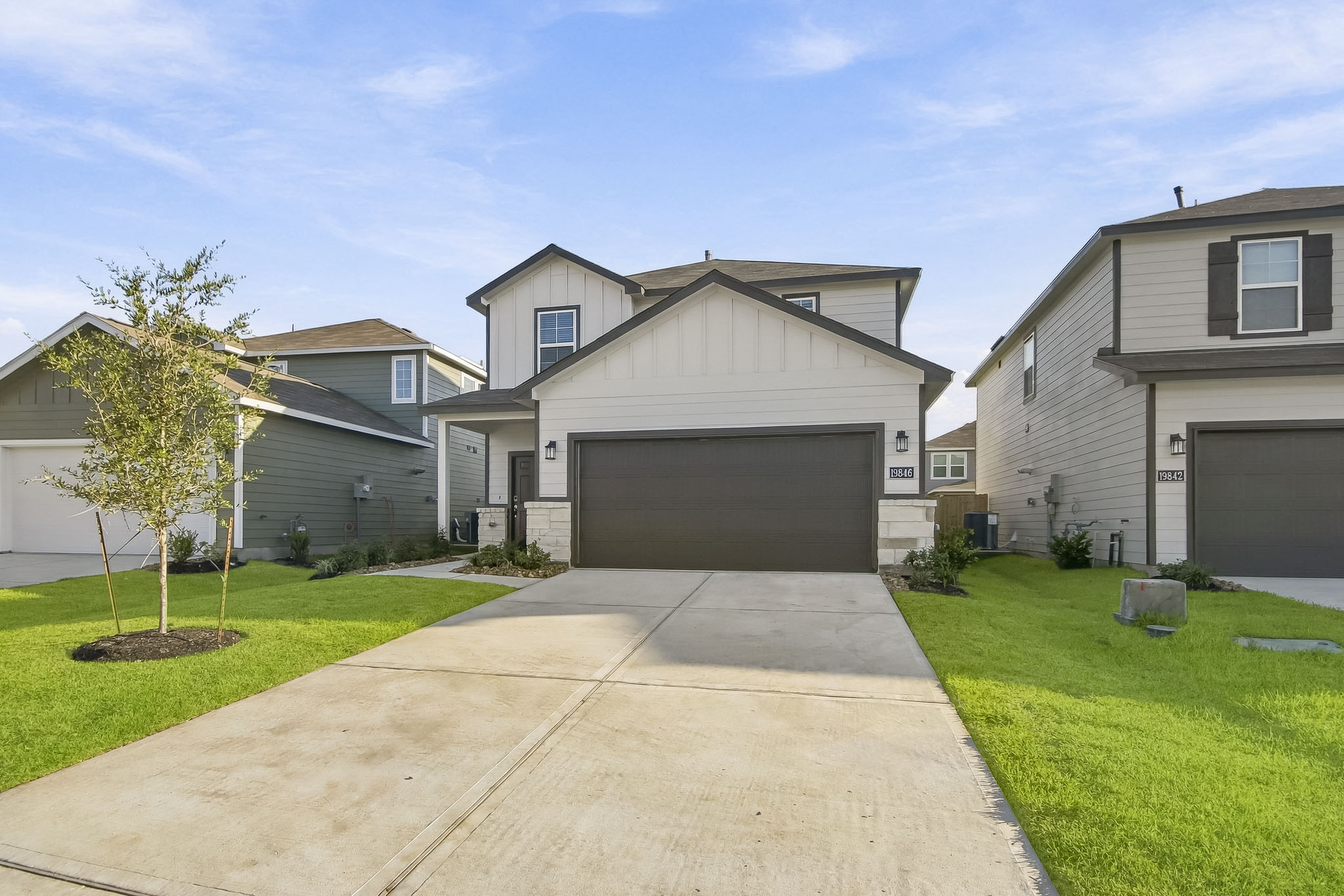 A driveway leading to a house.