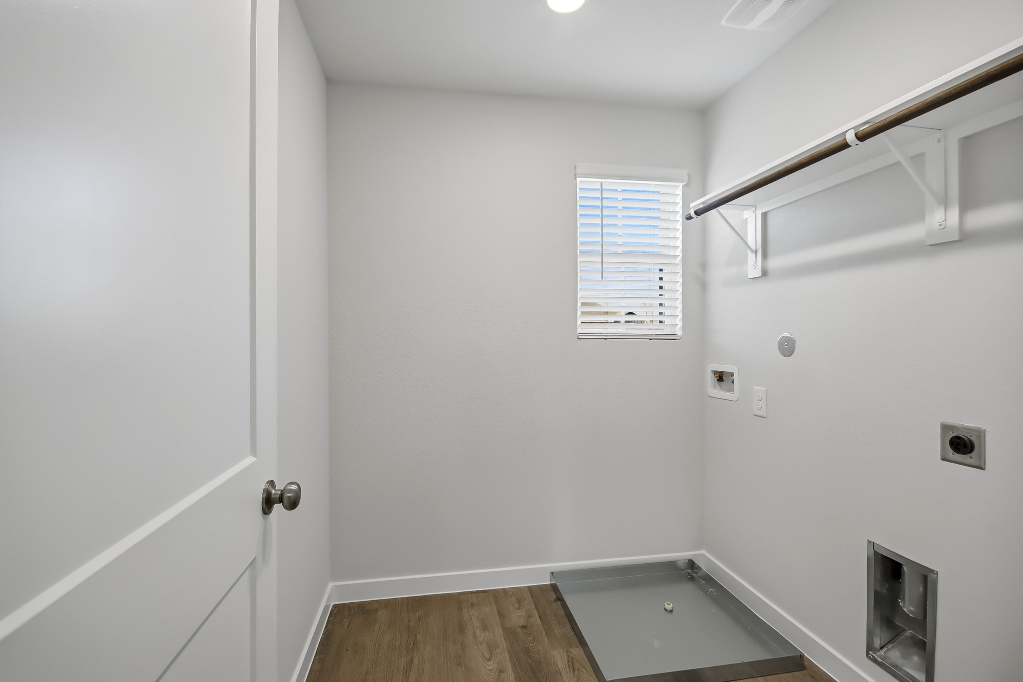 A room with a bathtub and a shower unit.