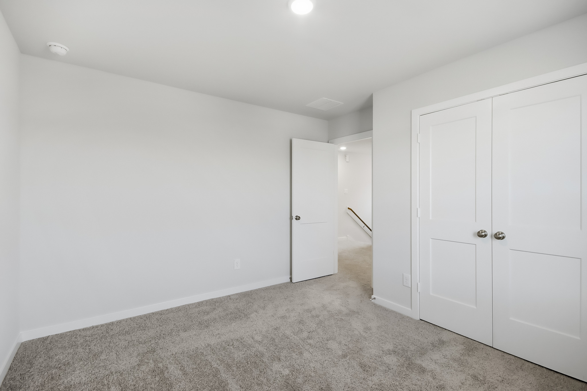 A room with white doors.