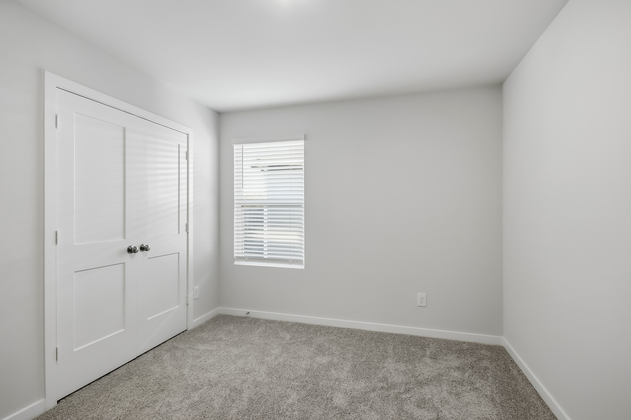 A room with white doors.