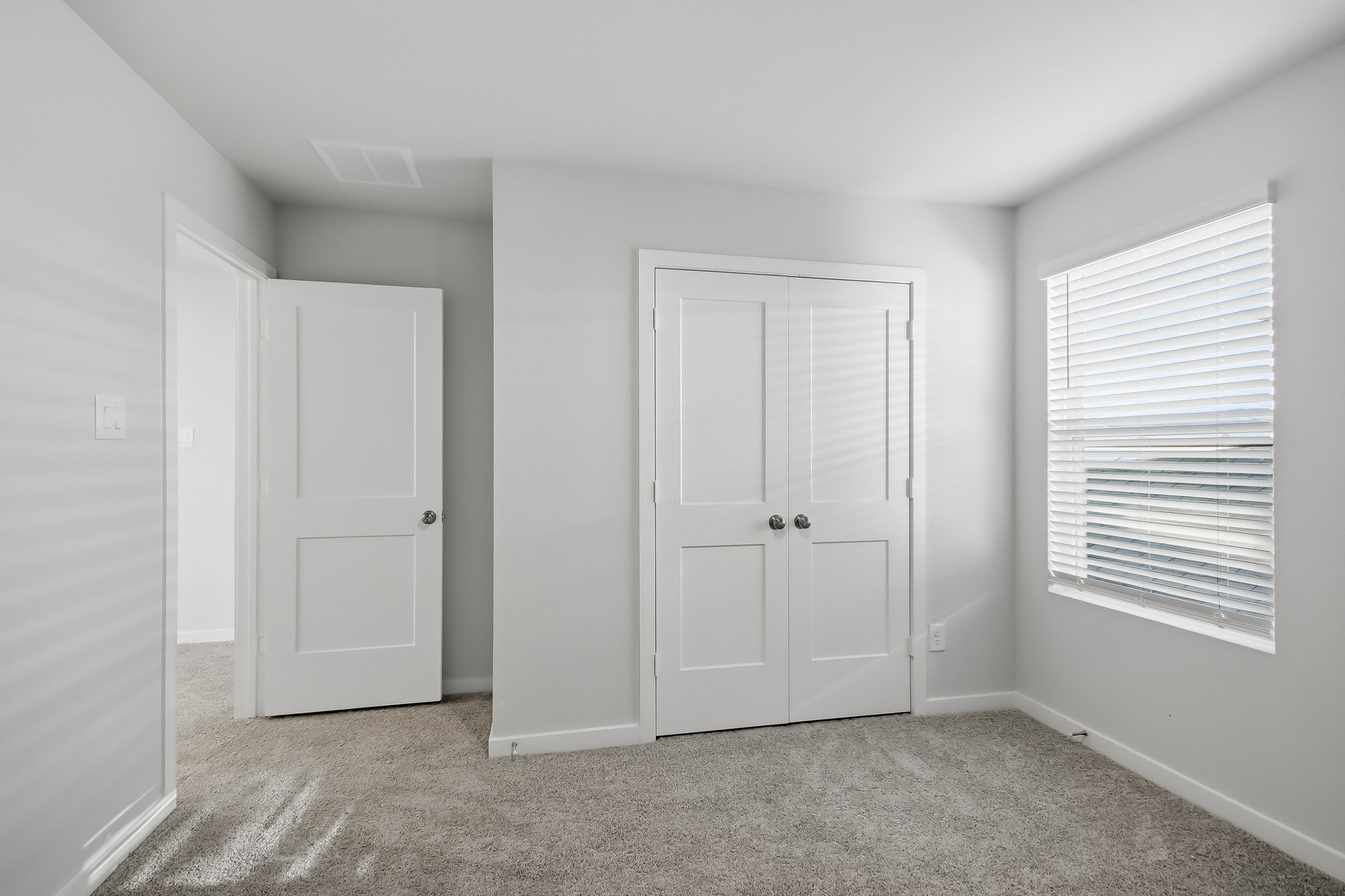 A room with white doors.