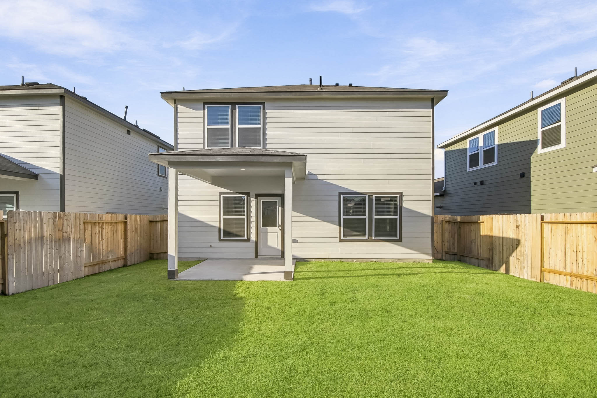 A house with a fence around it.
