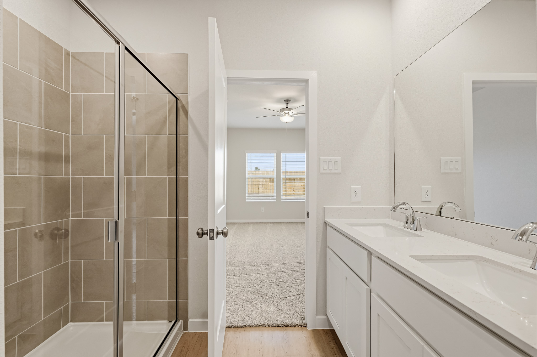 A bathroom with a glass shower.