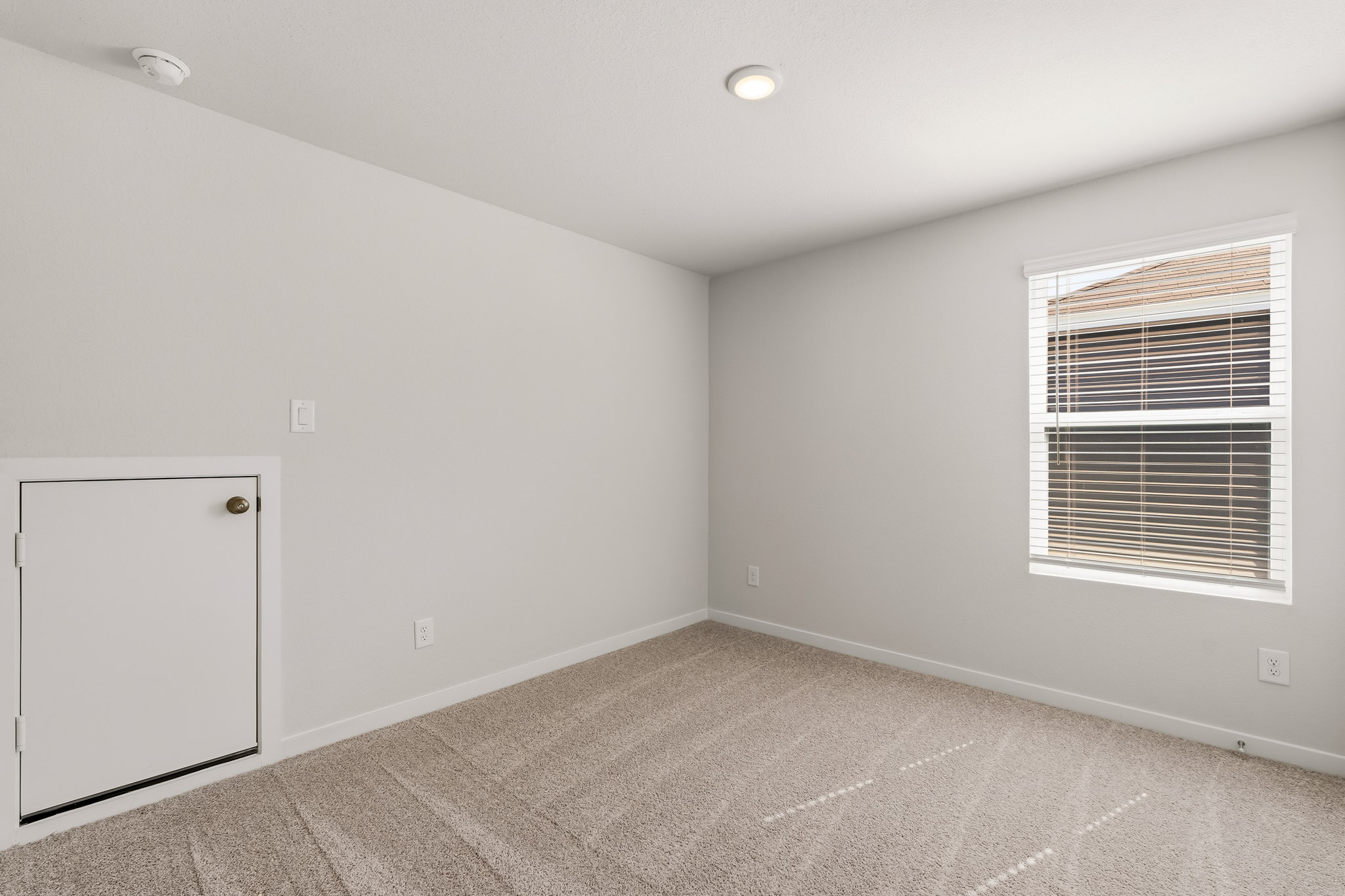A room with a door and a window.