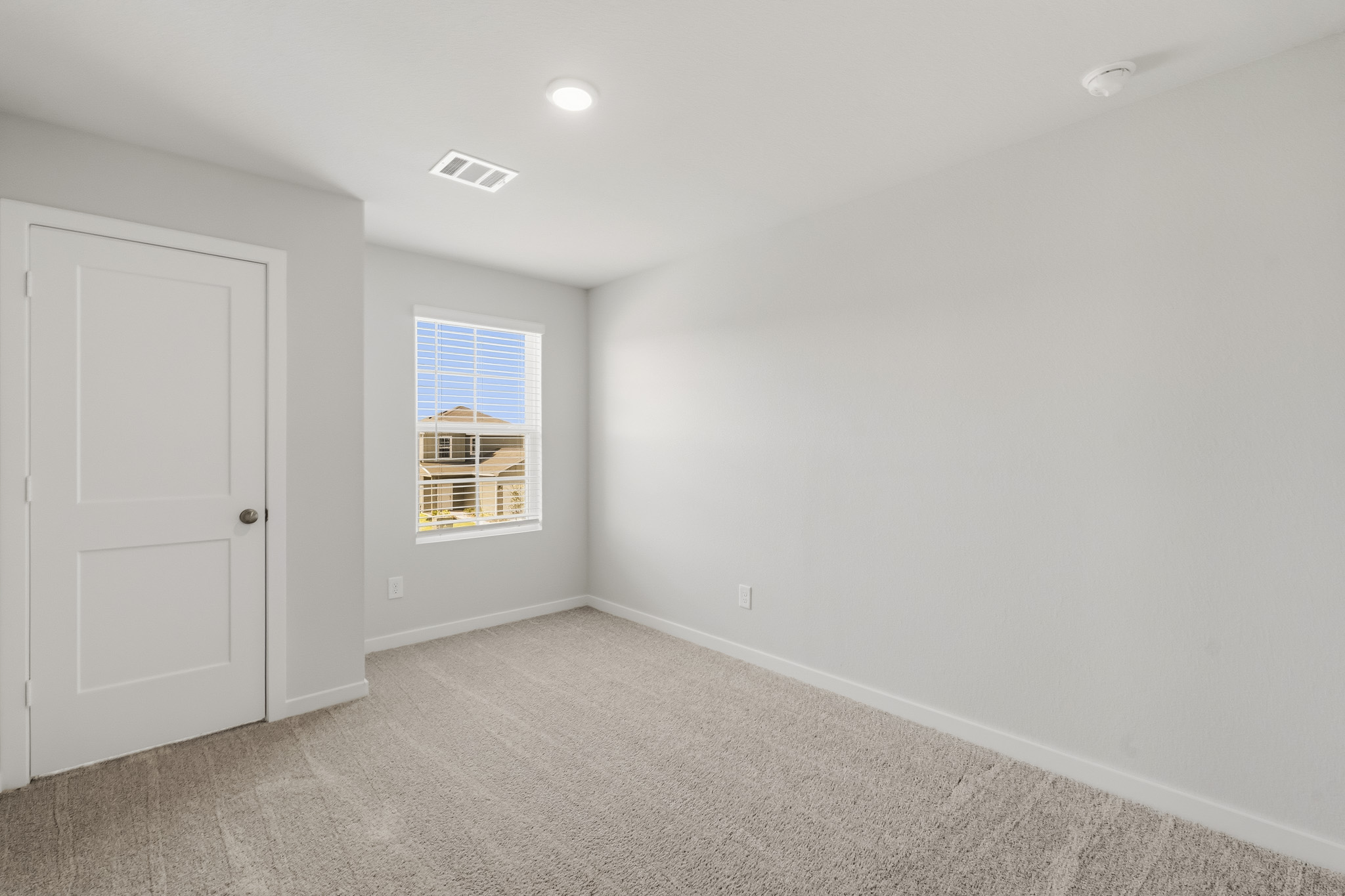 A room with a door and a window.
