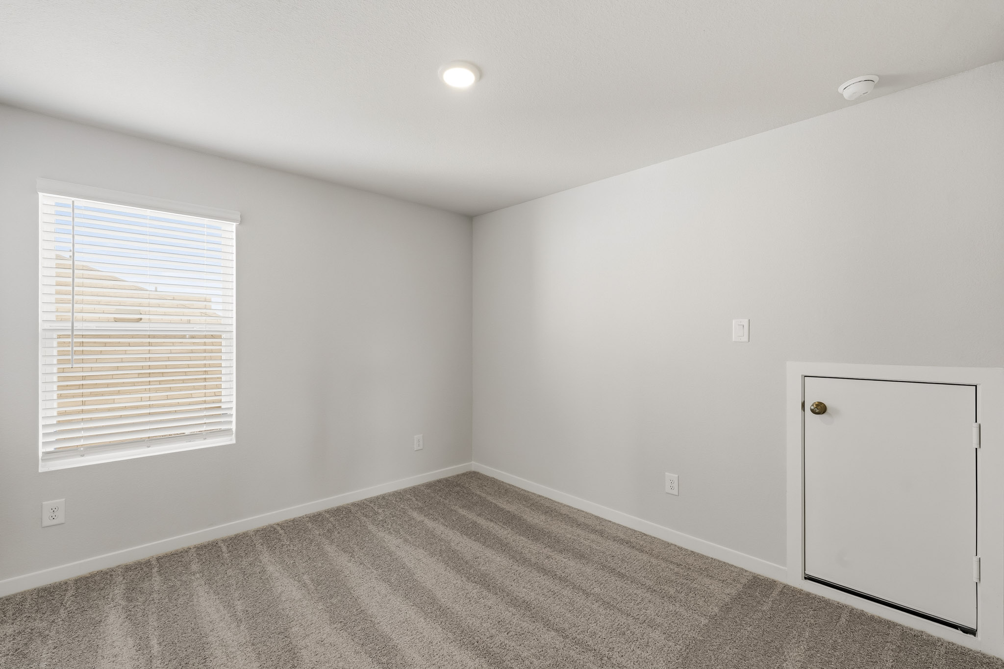 A room with a door and a window.