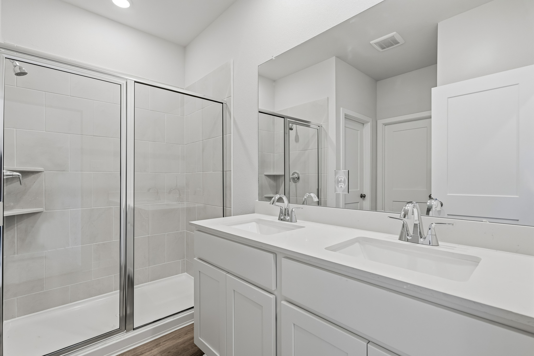 A bathroom with a glass shower.