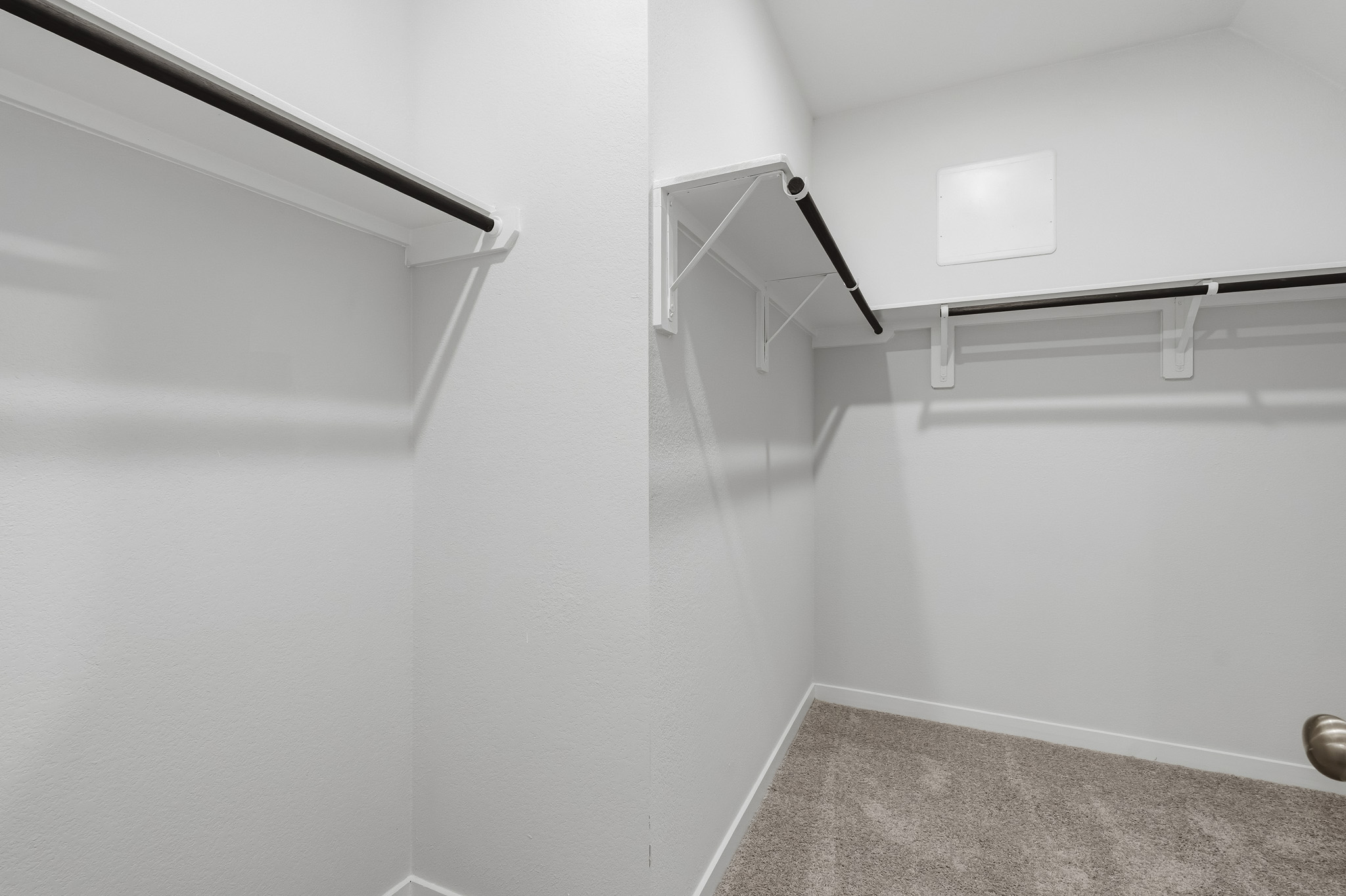 A white room with a staircase.