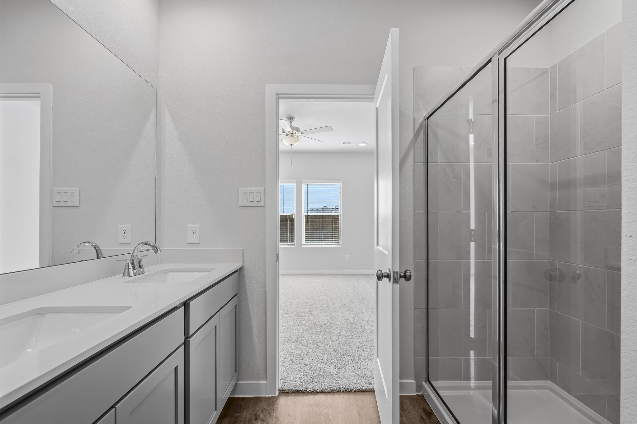 A bathroom with a glass shower.