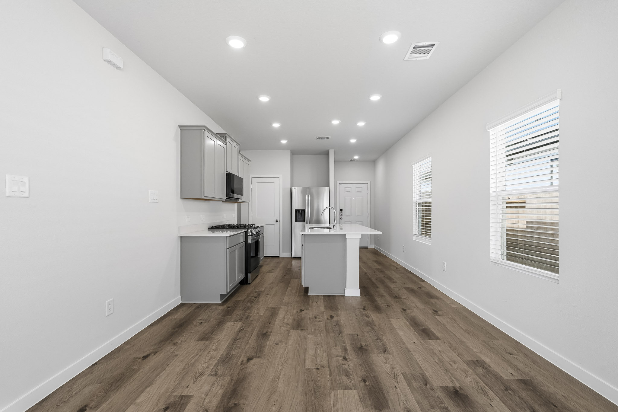 A kitchen with white walls.