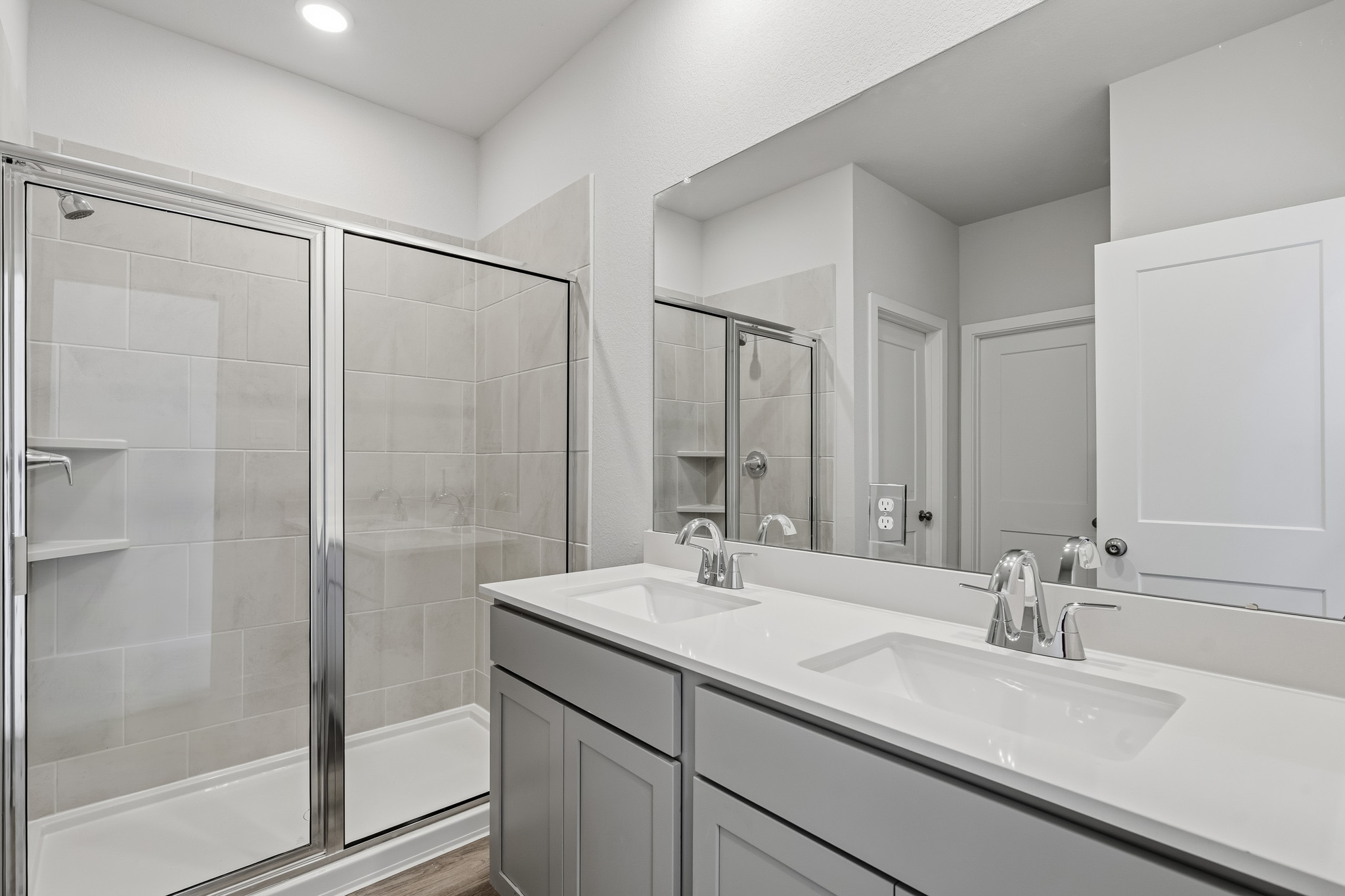A bathroom with a glass shower.