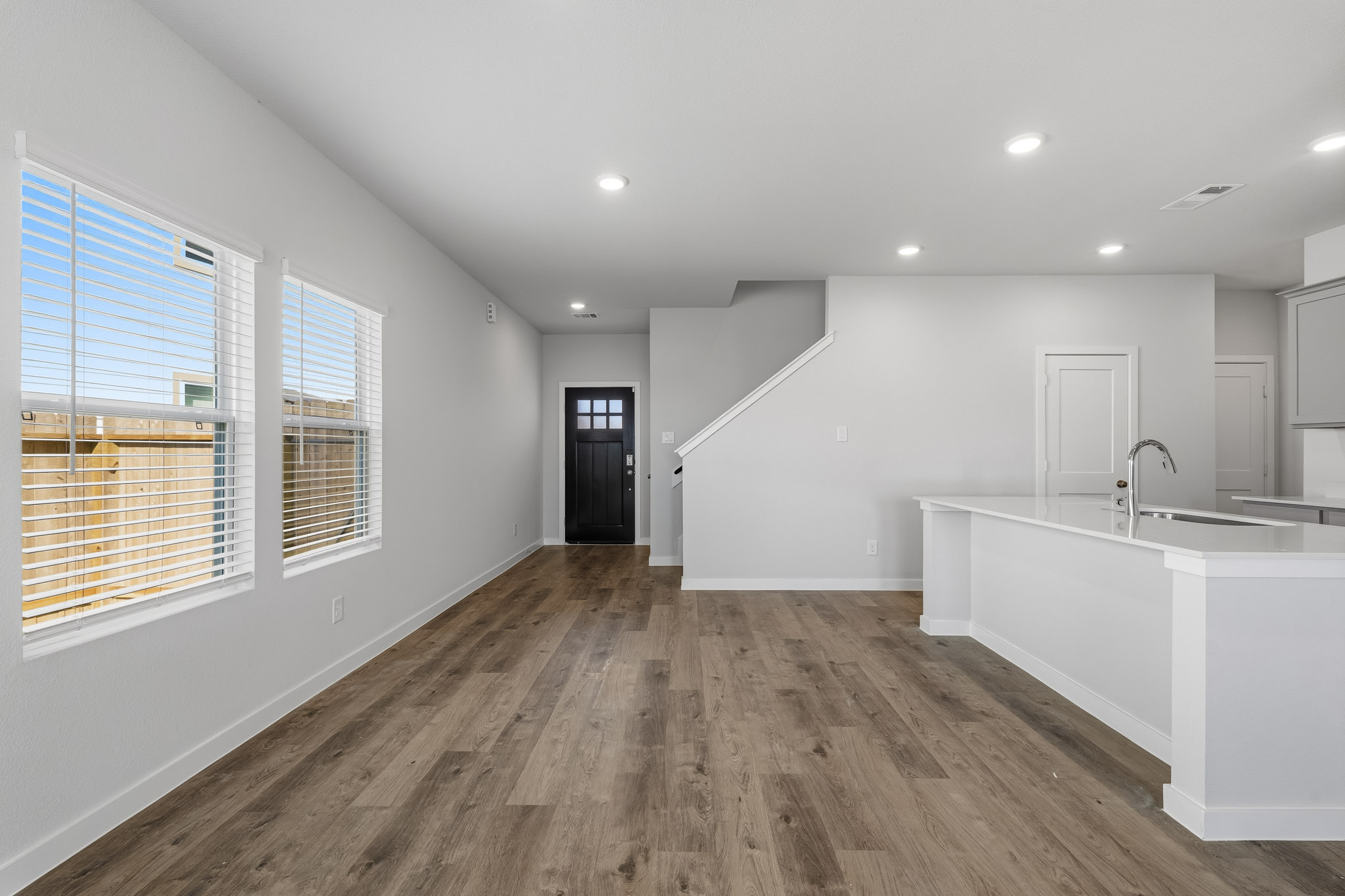 A bathroom with a wood floor.