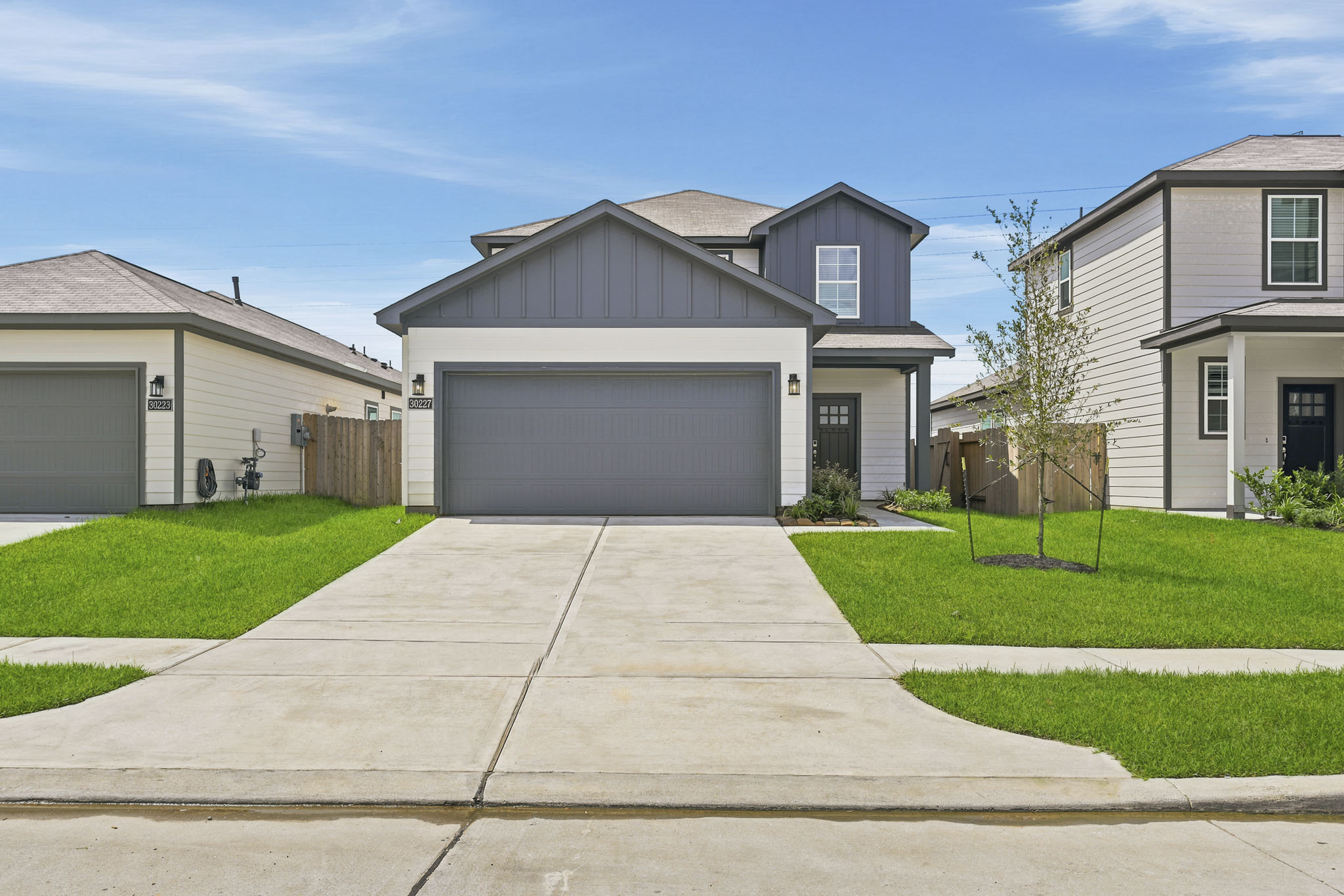 A driveway leading to a house.