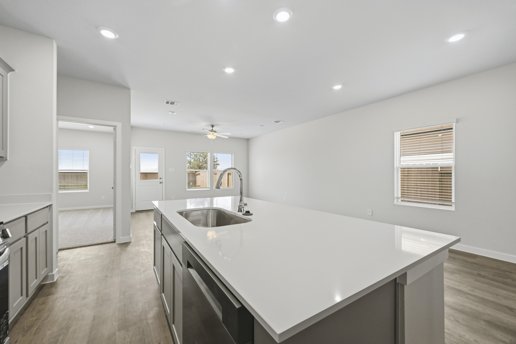 A kitchen with a sink and a counter top.