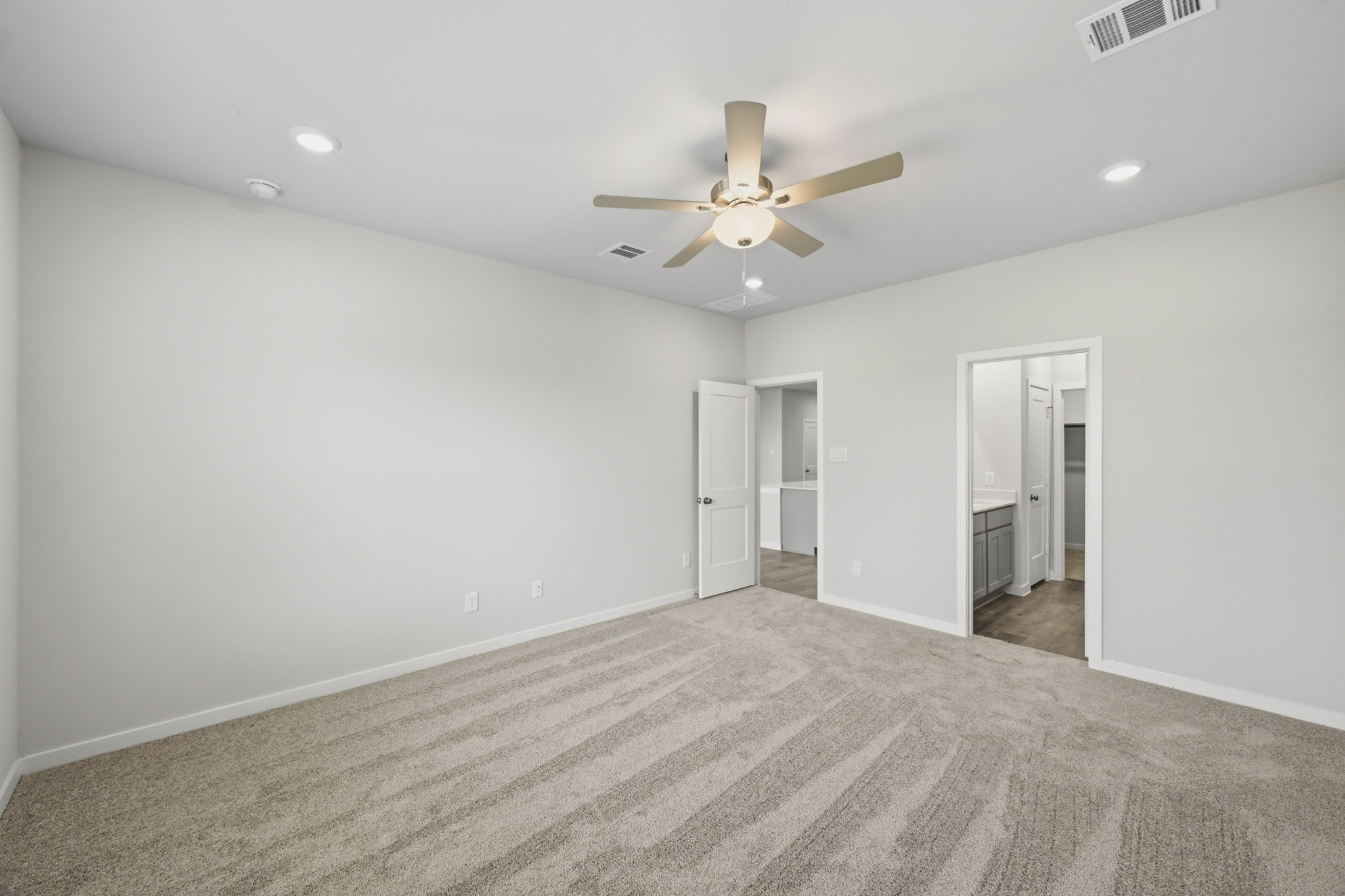 A room with a ceiling fan and a ceiling fan.