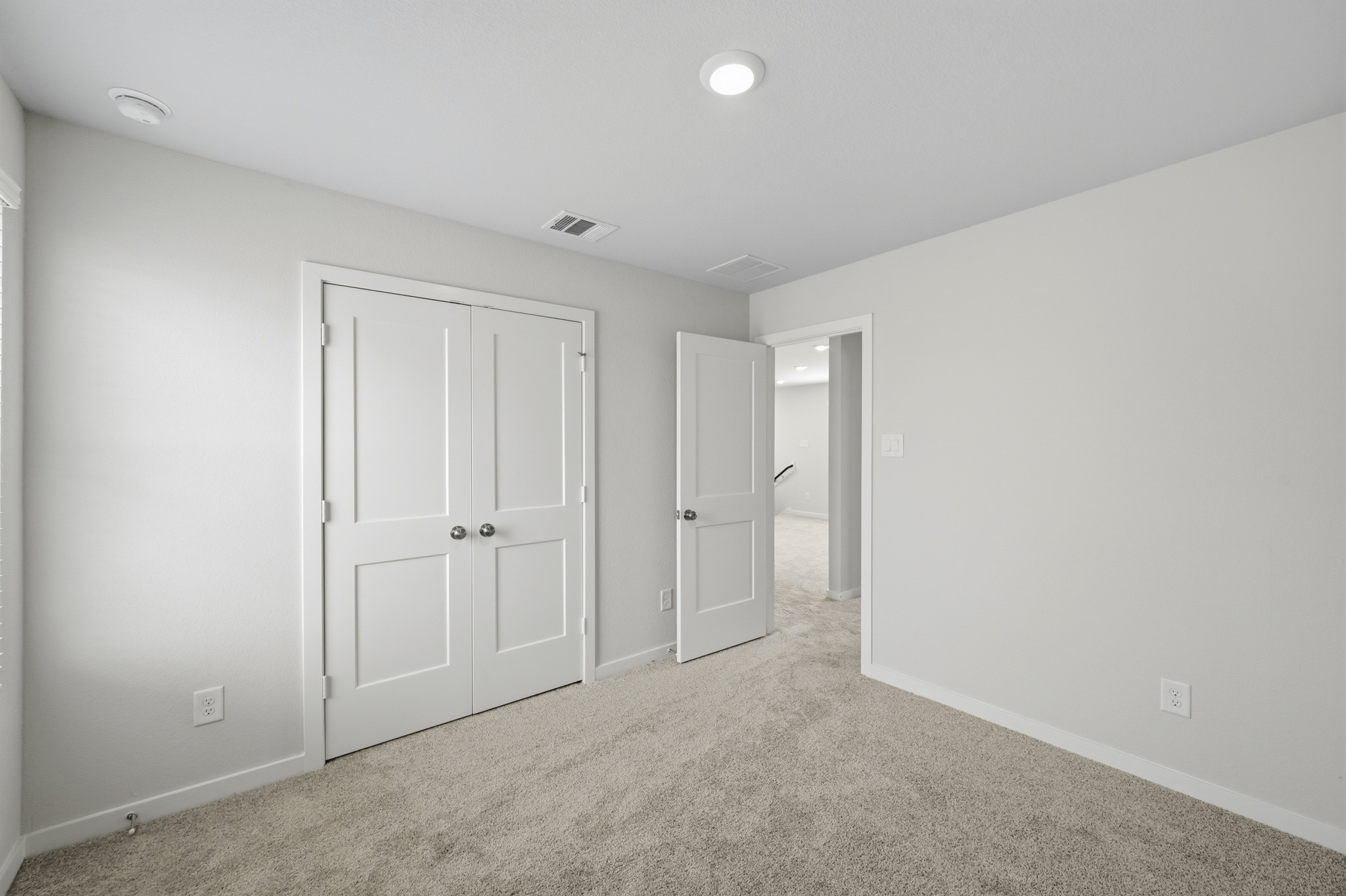 A room with white doors.
