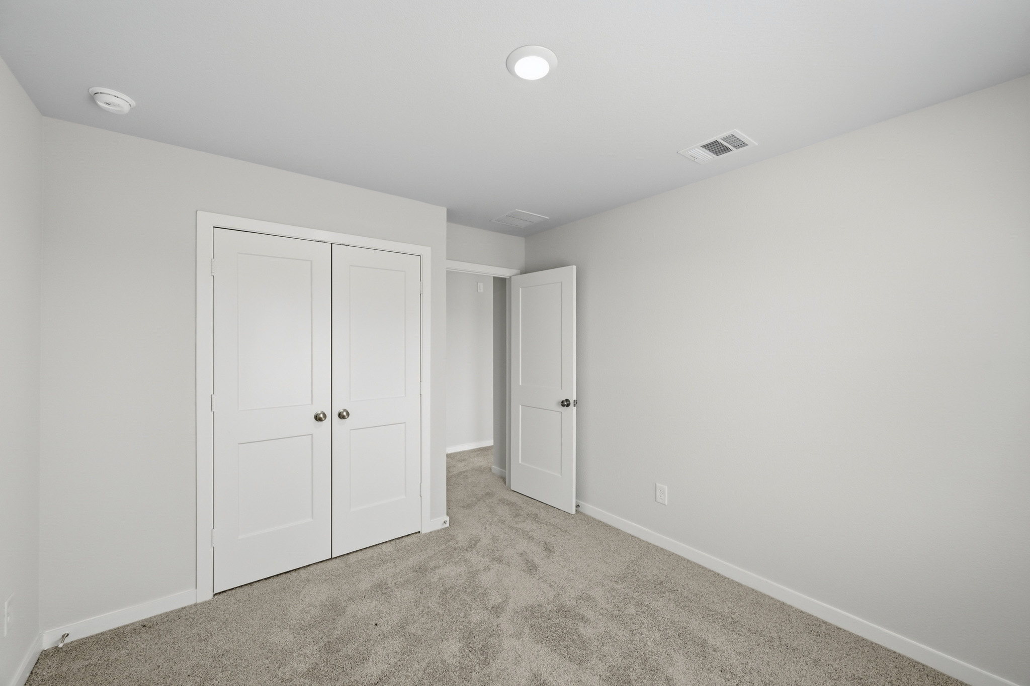 A room with white doors.