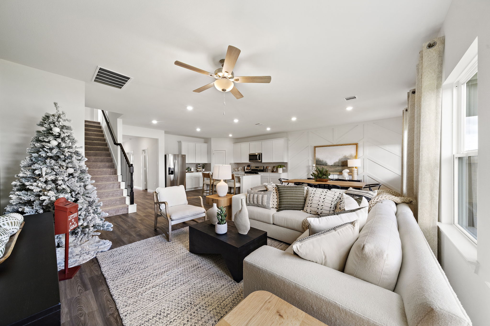 A living room with a christmas tree.