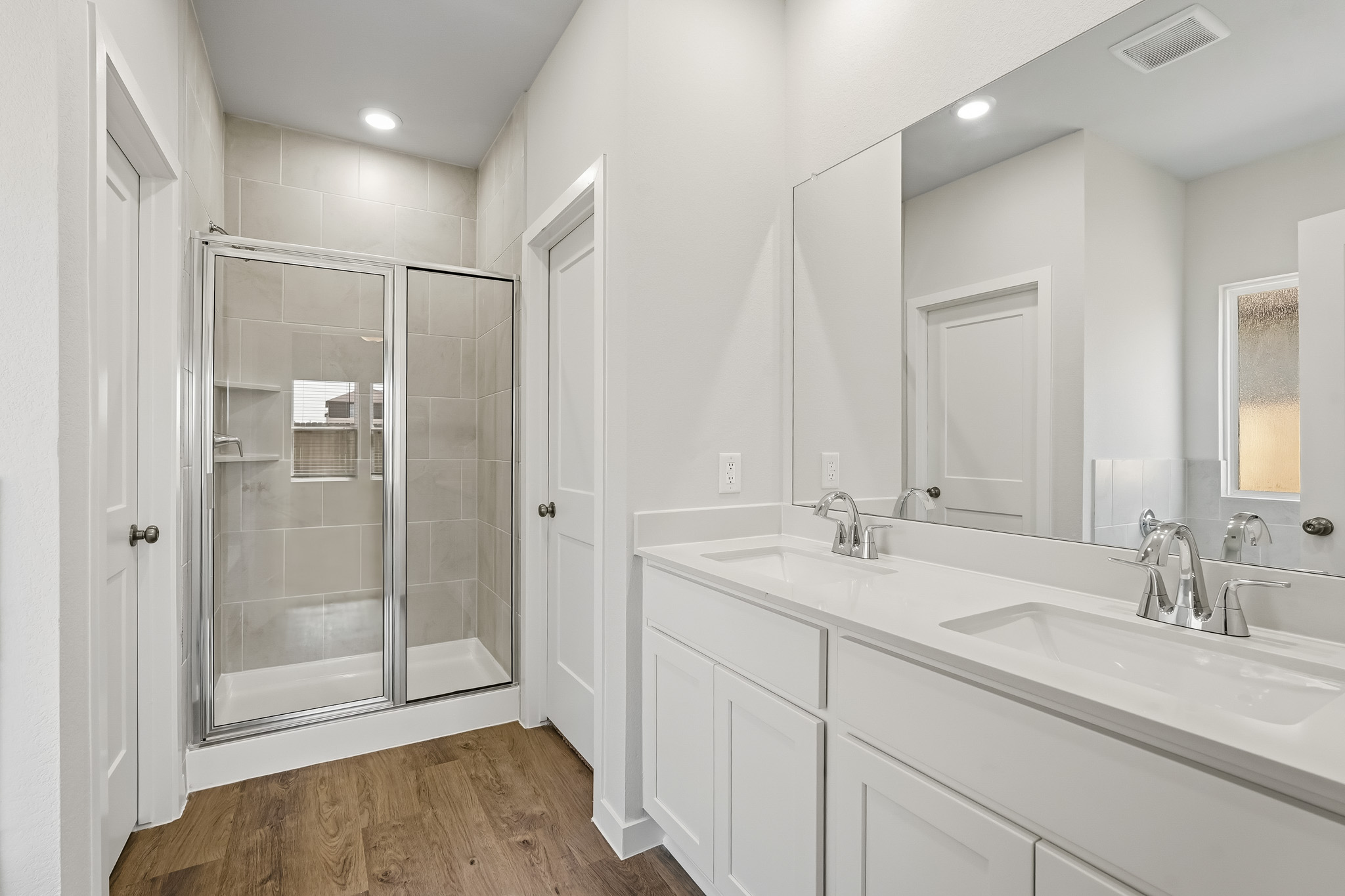 A bathroom with a glass shower.