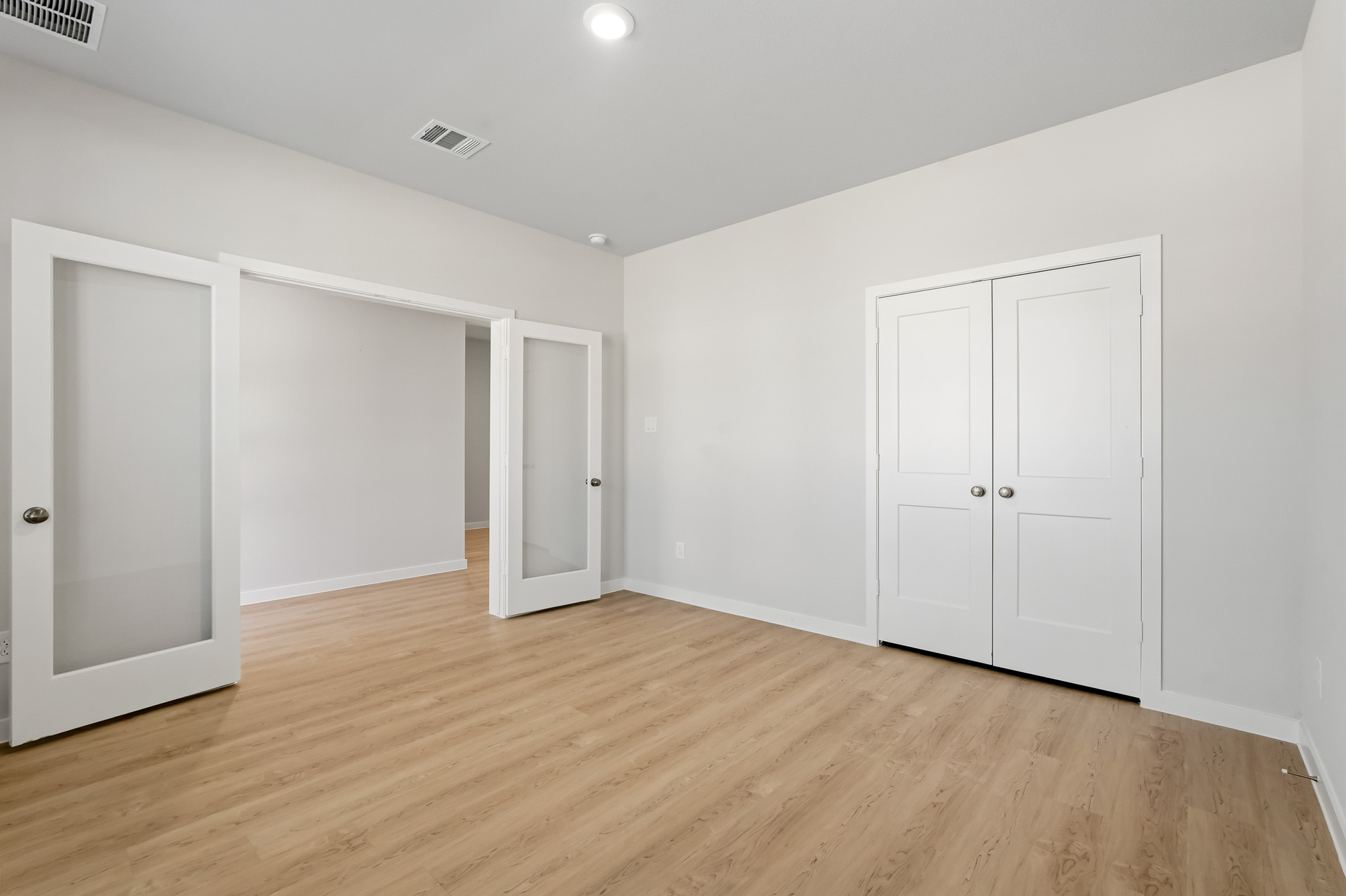 A room with white doors.