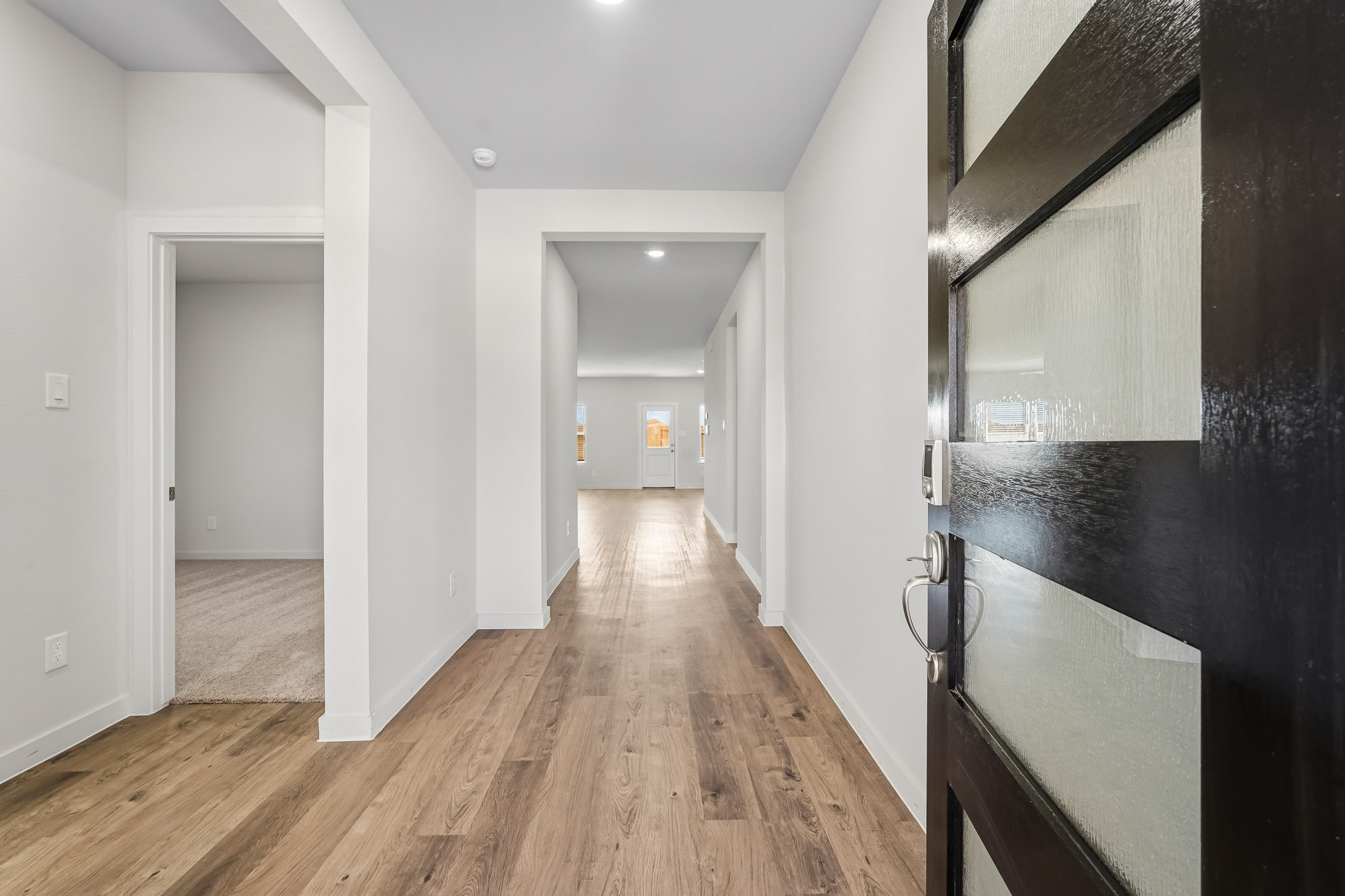 A hallway with black walls.