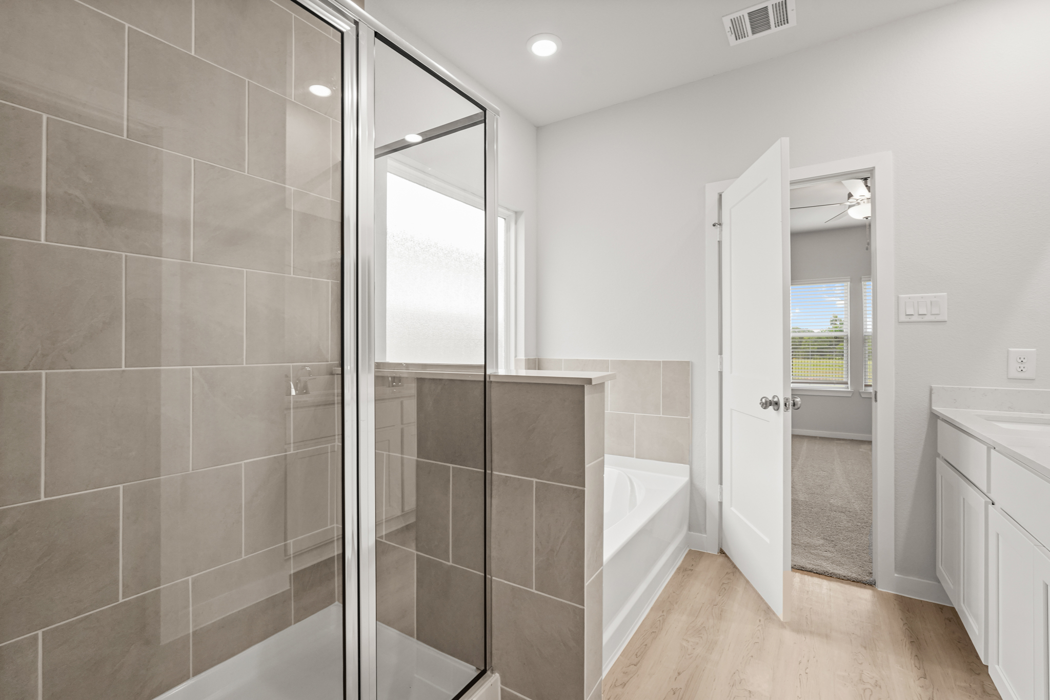 A bathroom with a glass shower.