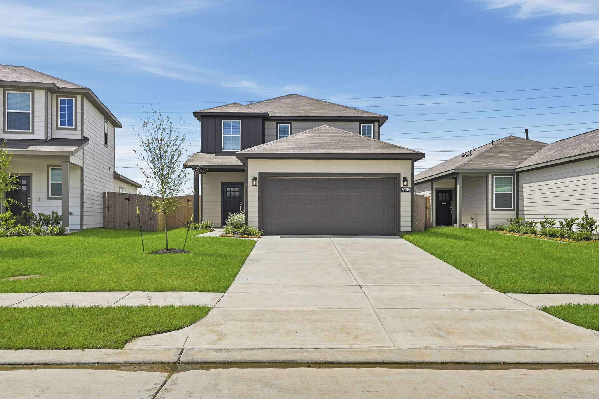 A driveway leading to a house.