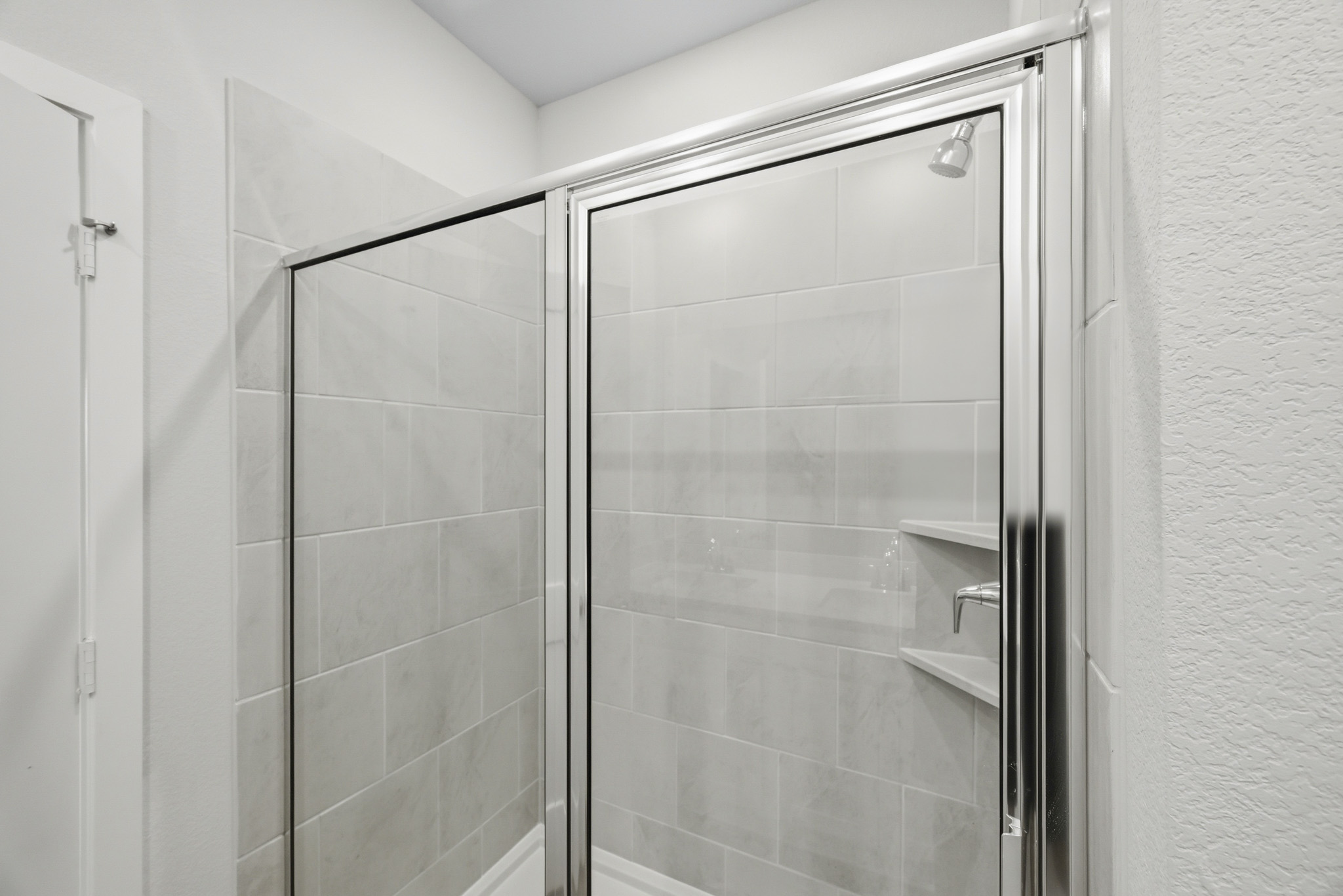 A shower unit in a bathroom.