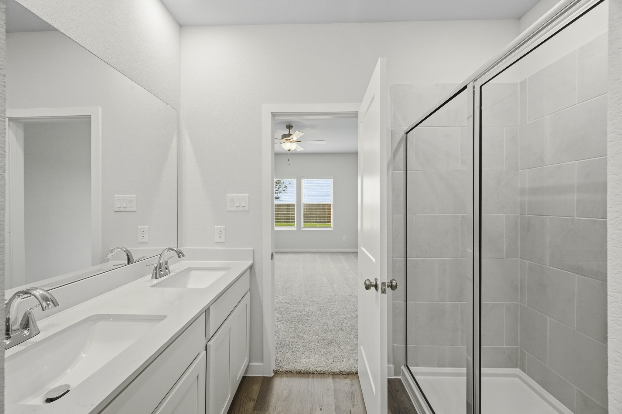 A bathroom with a glass shower.