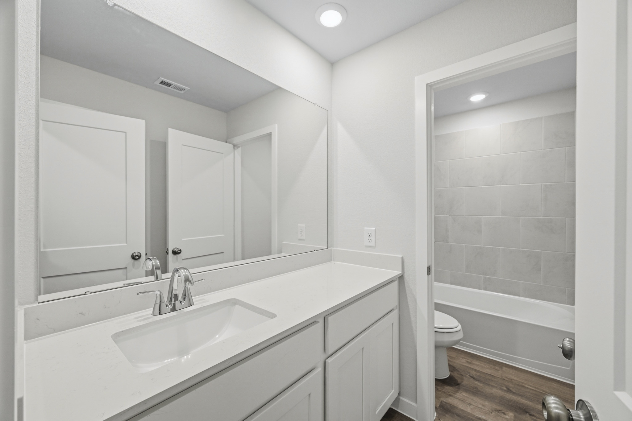 A bathroom with a sink and a toilet.